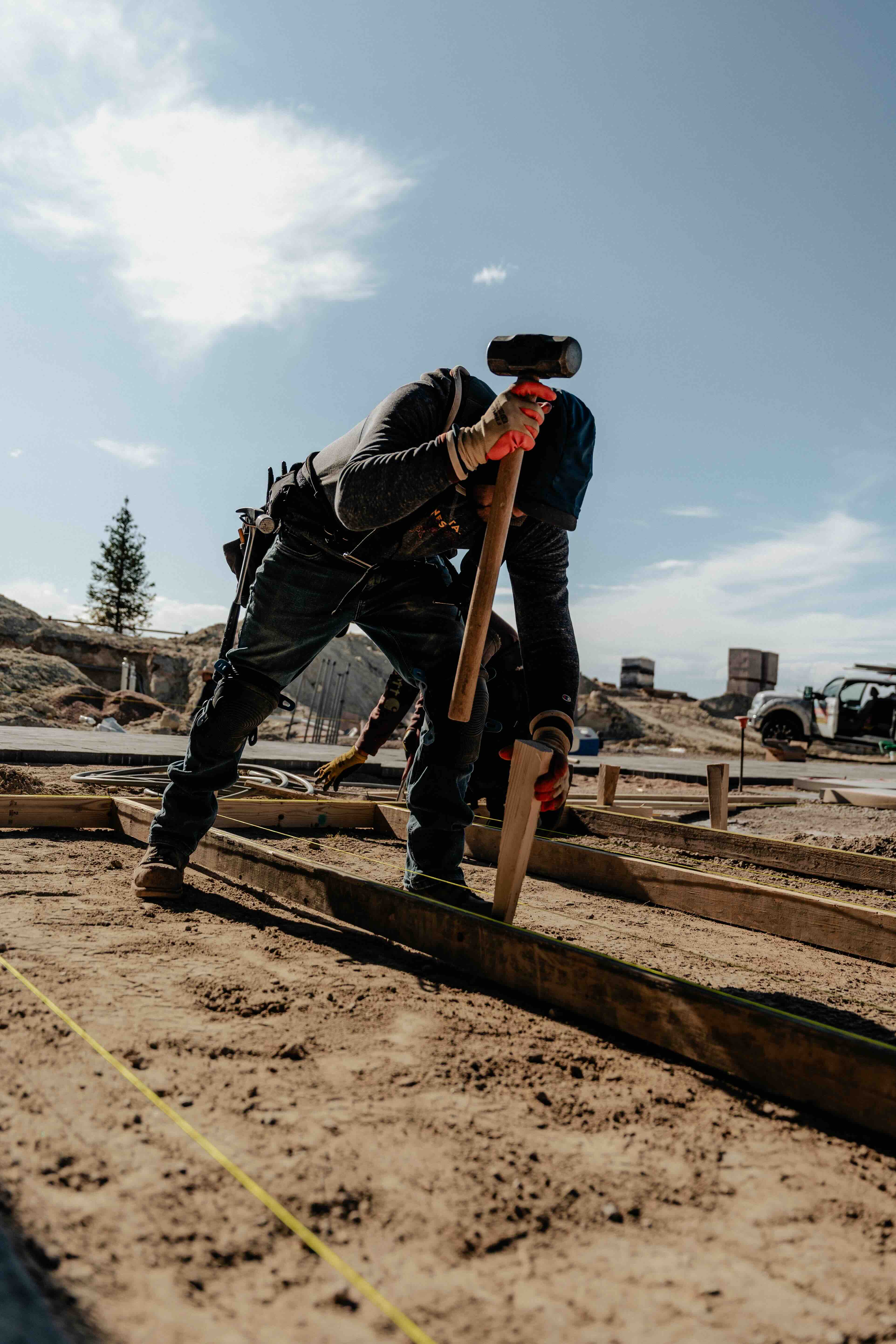 Contractor social media content - holiday light installer reaching roofline