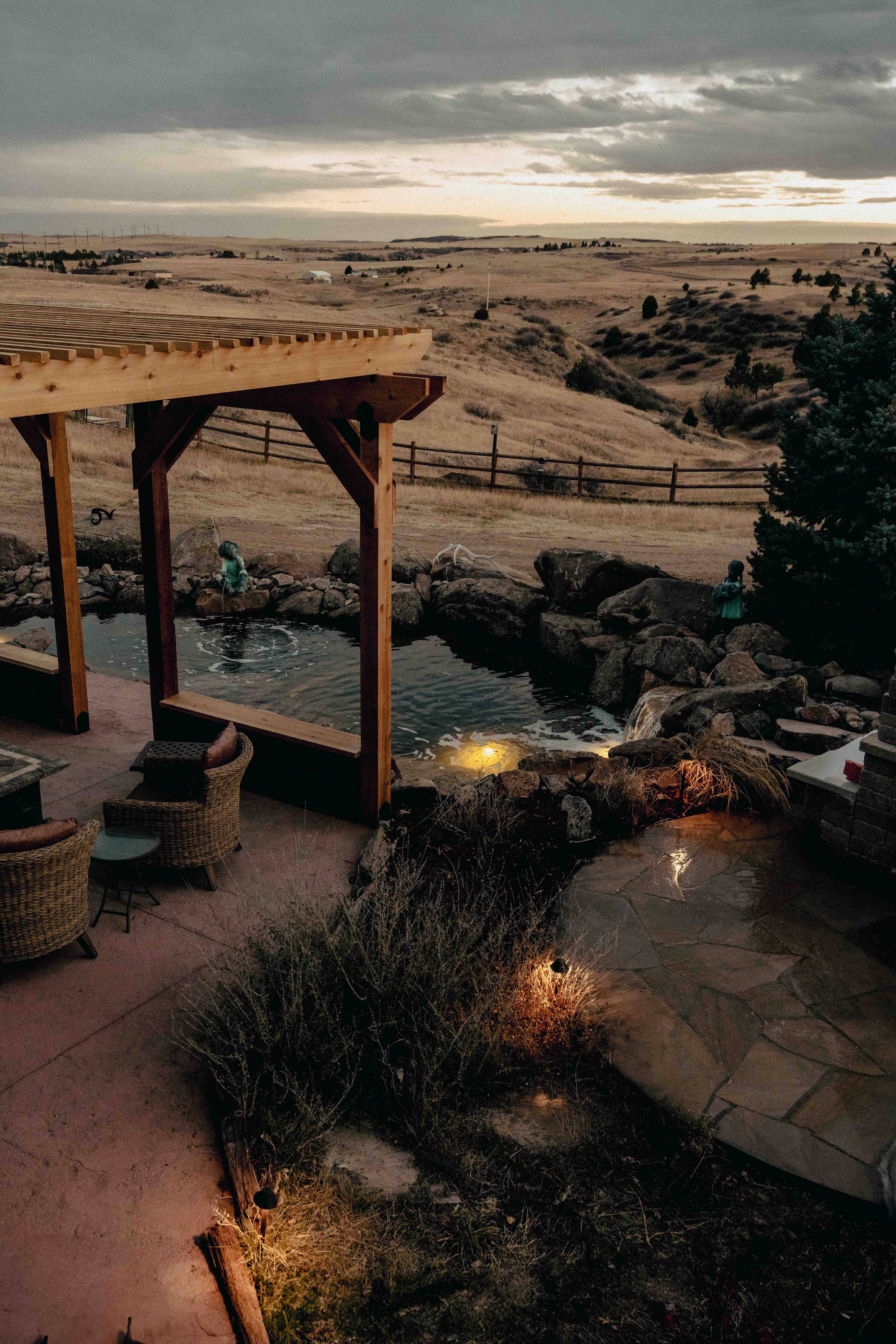 Contractor social media content - custom water feature with canoe fountain on stone wall