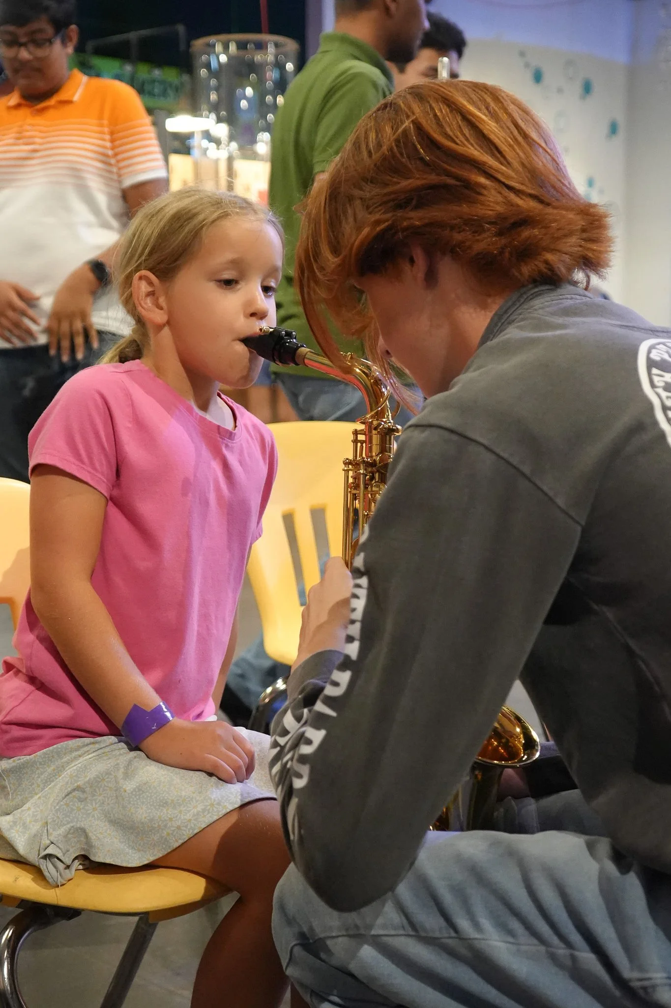 Student learning saxophone
