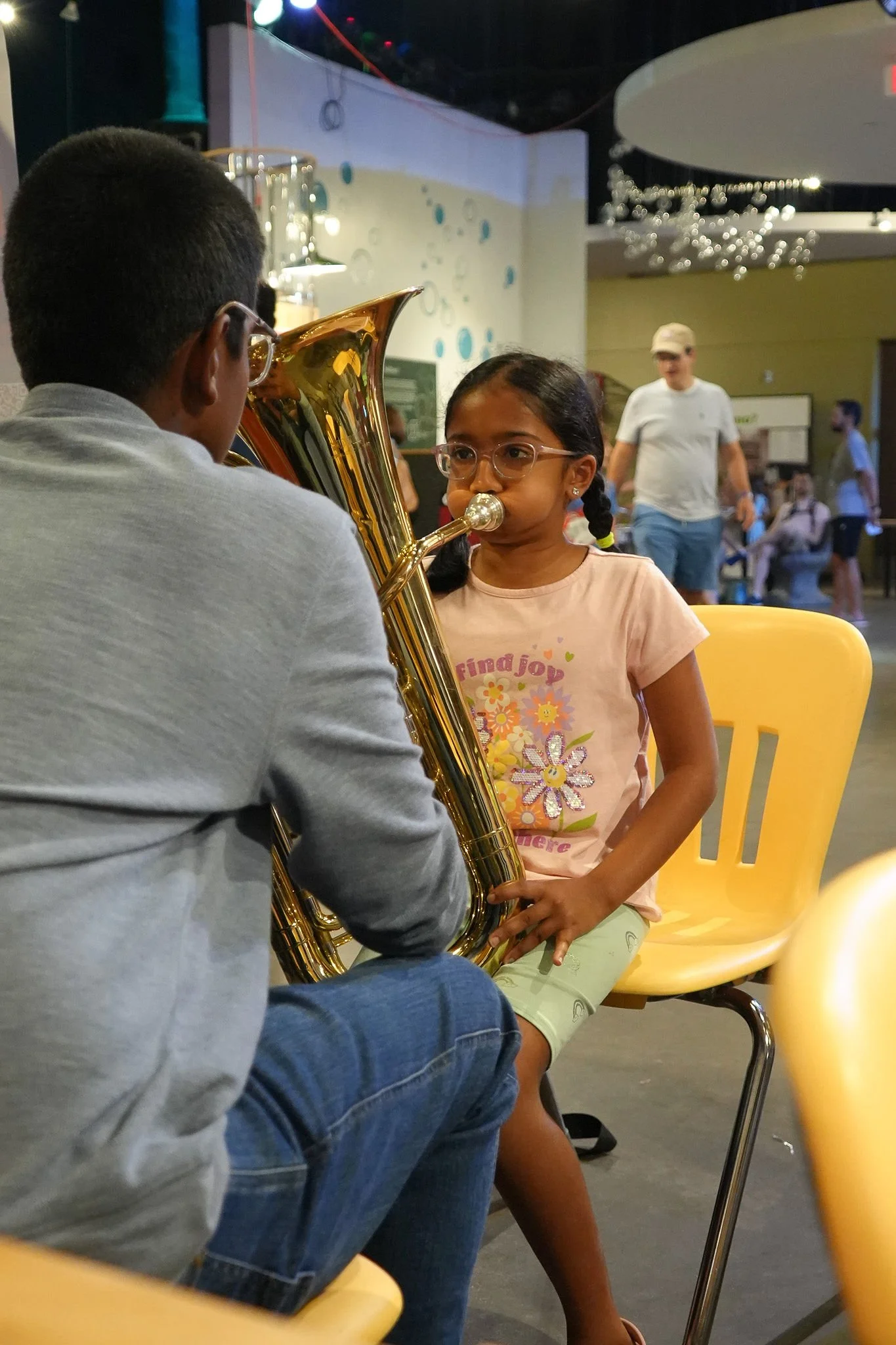 Young girl trying tuba