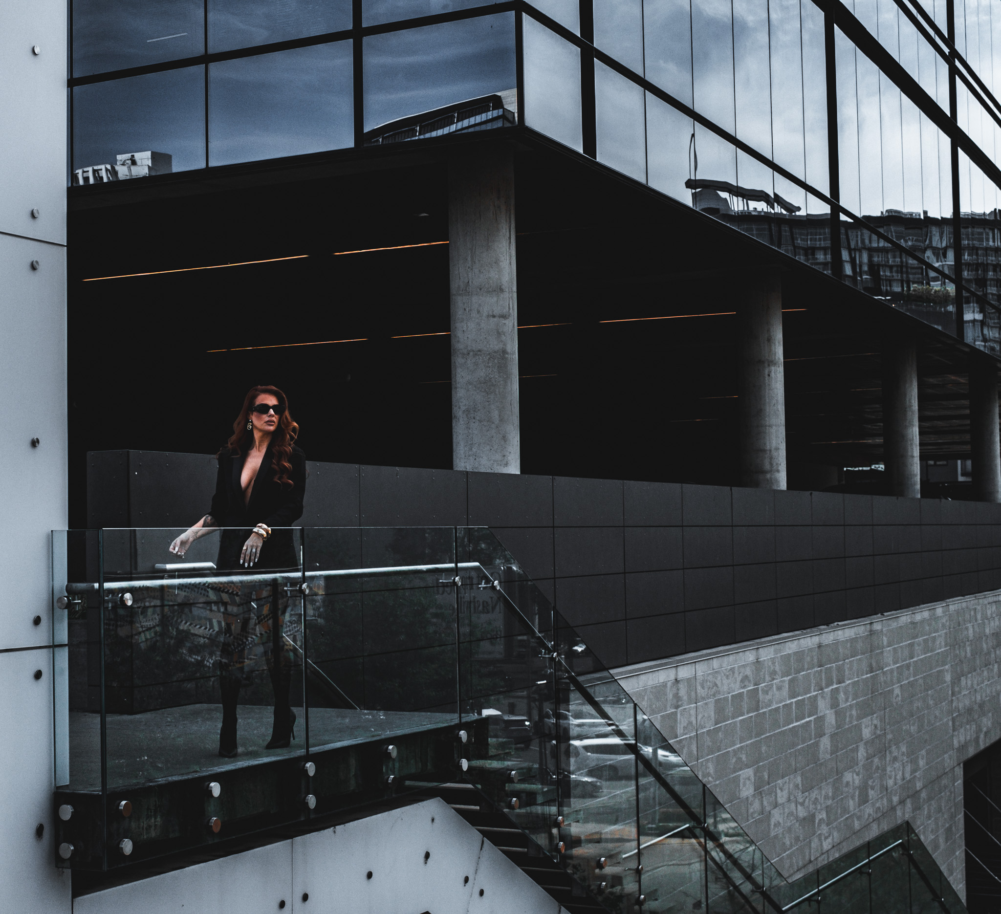Woman on modern architectural balcony
