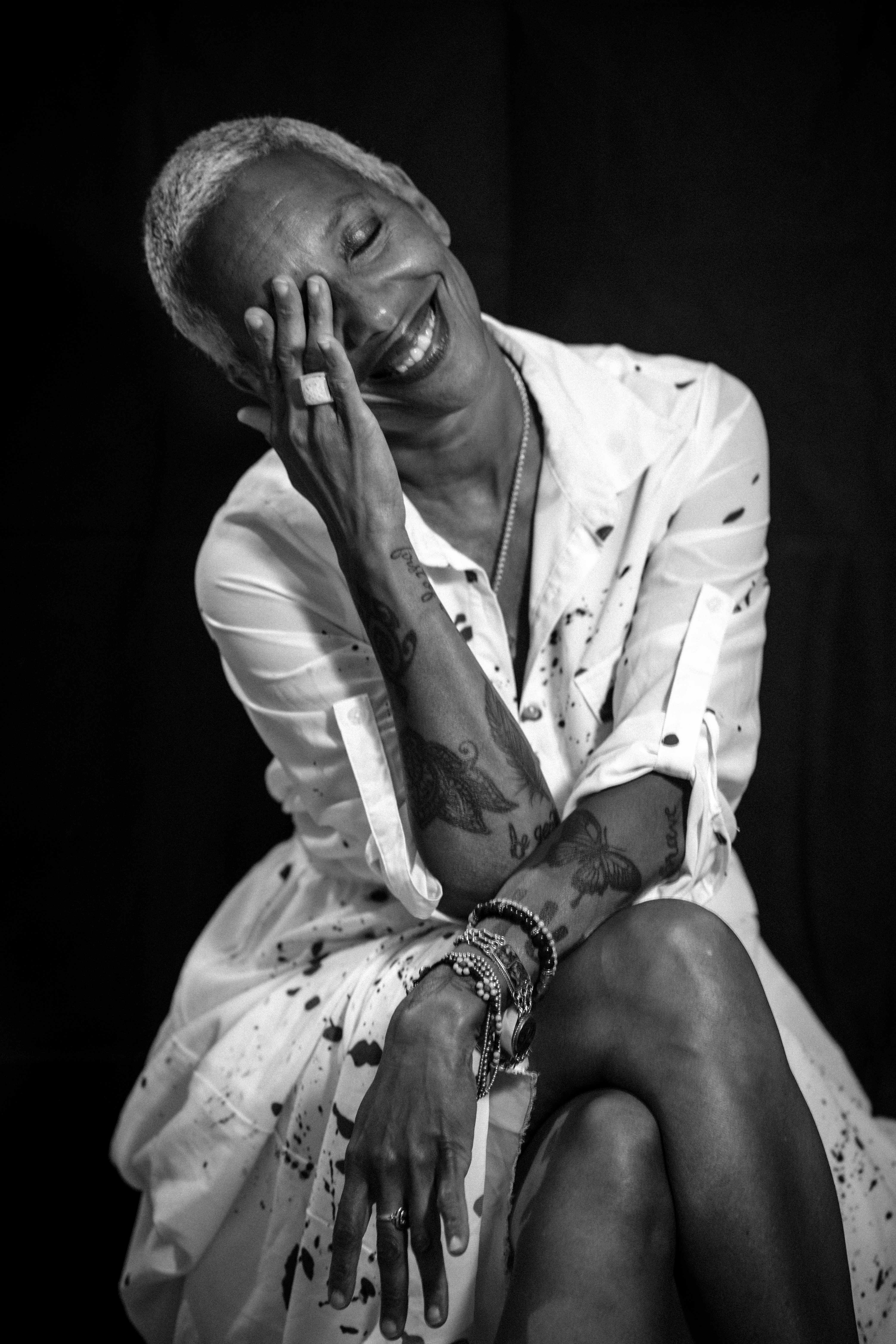 Woman laughing with hand on face