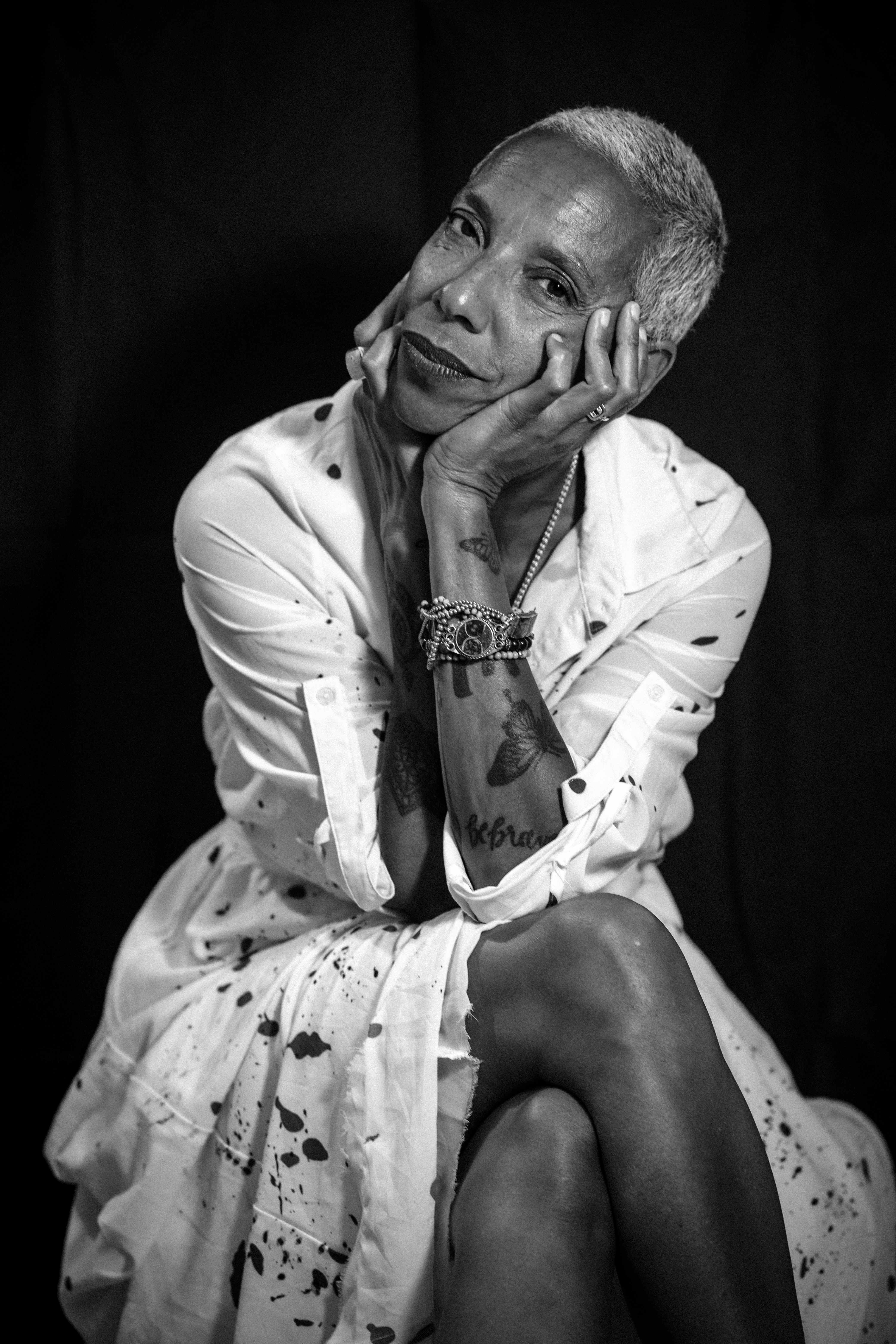 Woman with short gray hair in contemplative pose