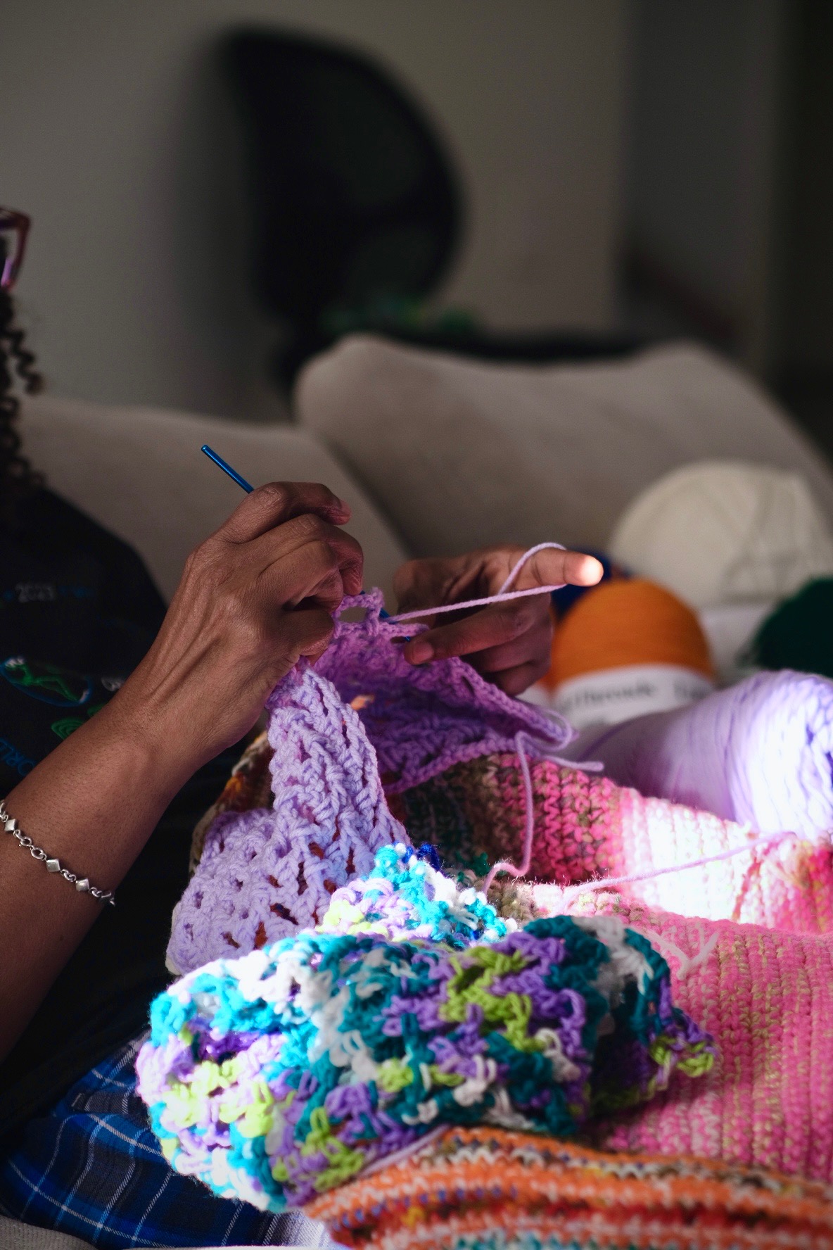 Mom hand-crocheting at home