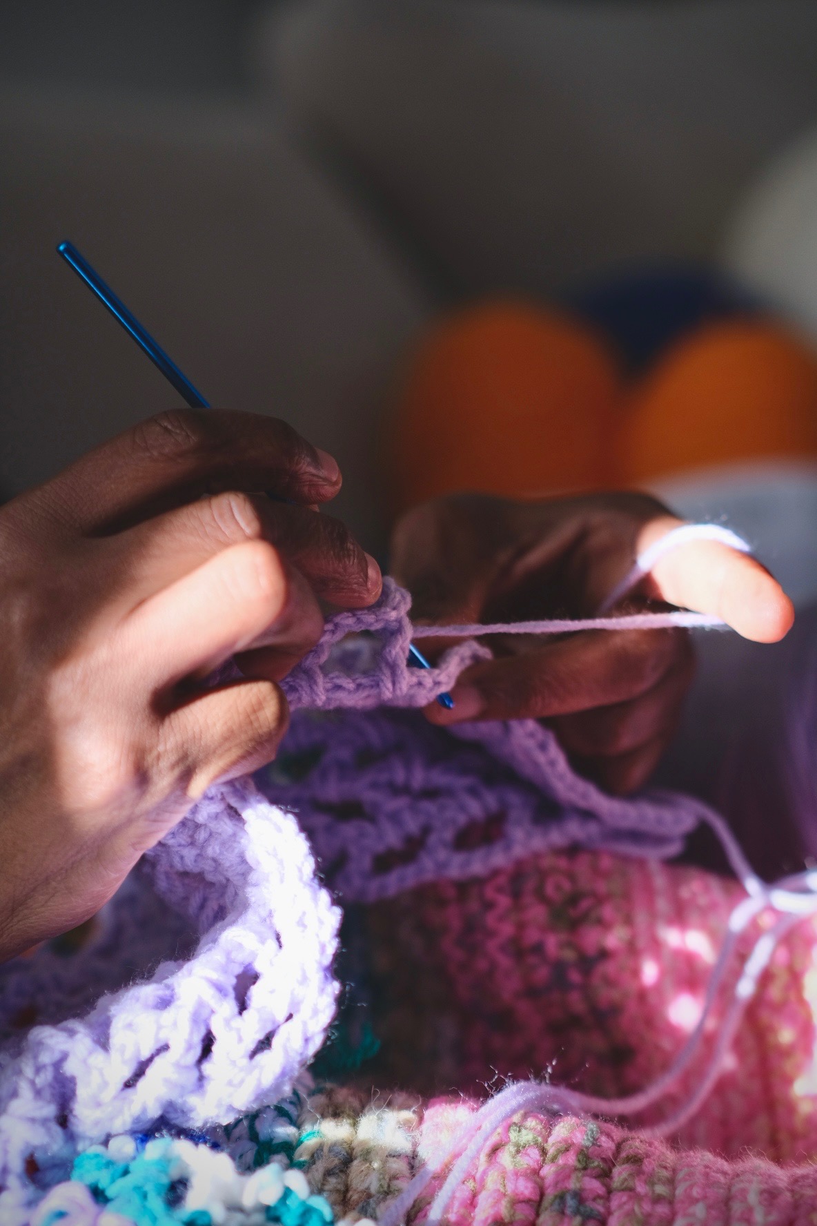 Hands crocheting in natural light