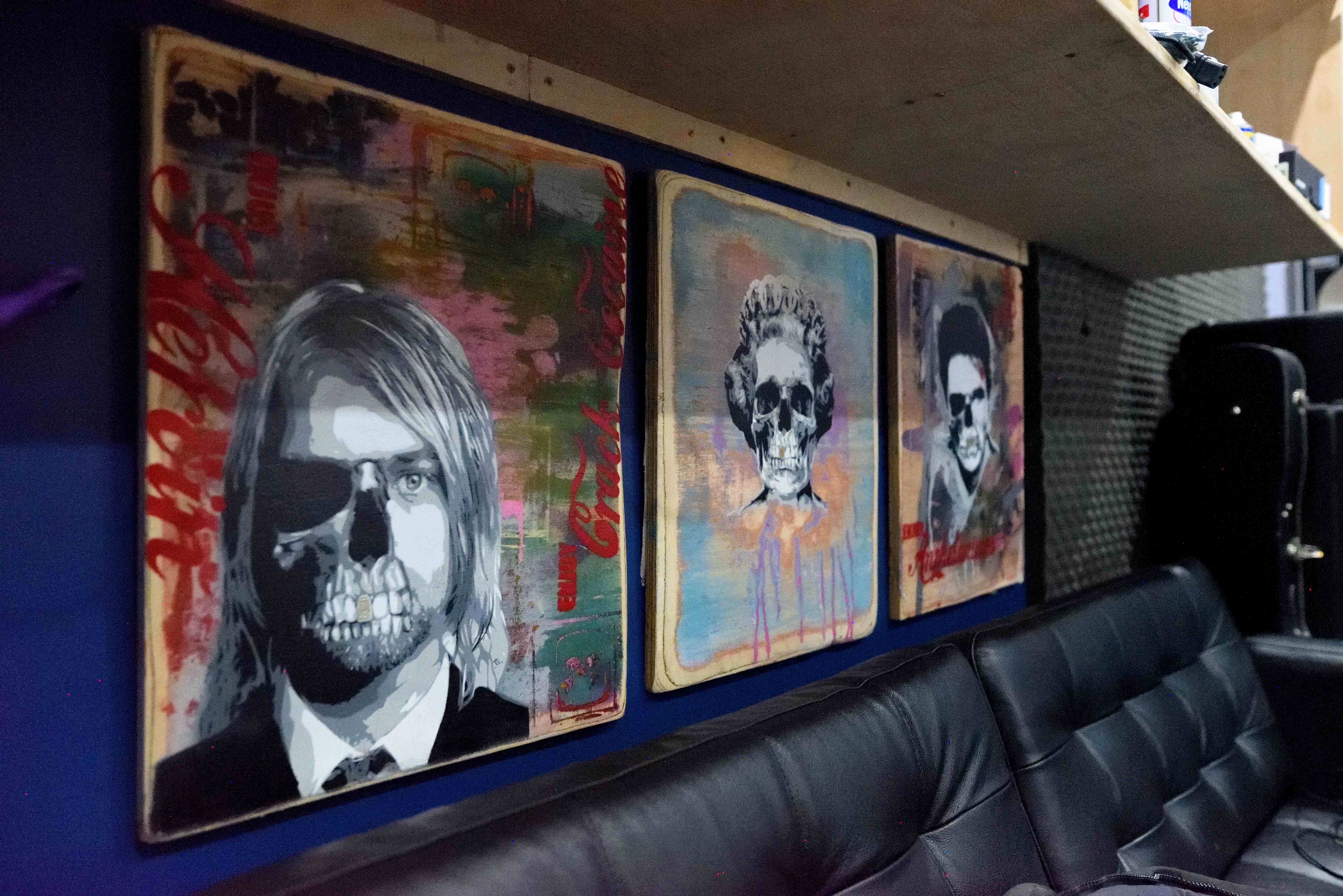 Studio wall art with skull portraits