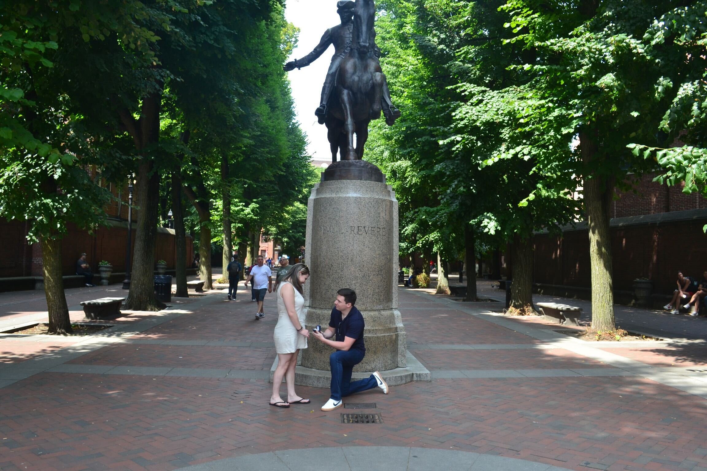 Ben proposing to Brooke at the Paul Revere statue in Boston's North End