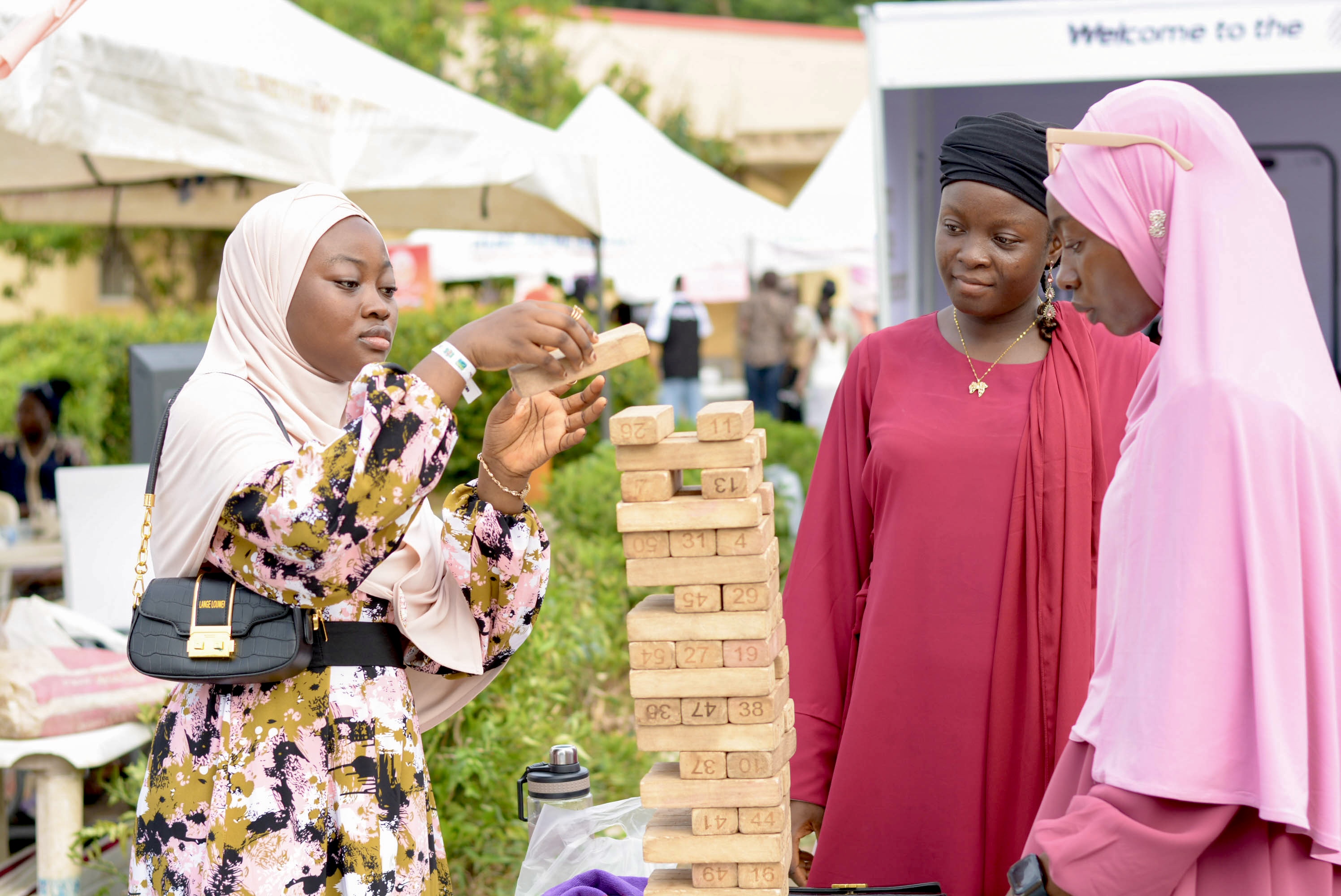 Attendees enjoying a game of Jenga at EidGlitz, showcasing the fun activities available