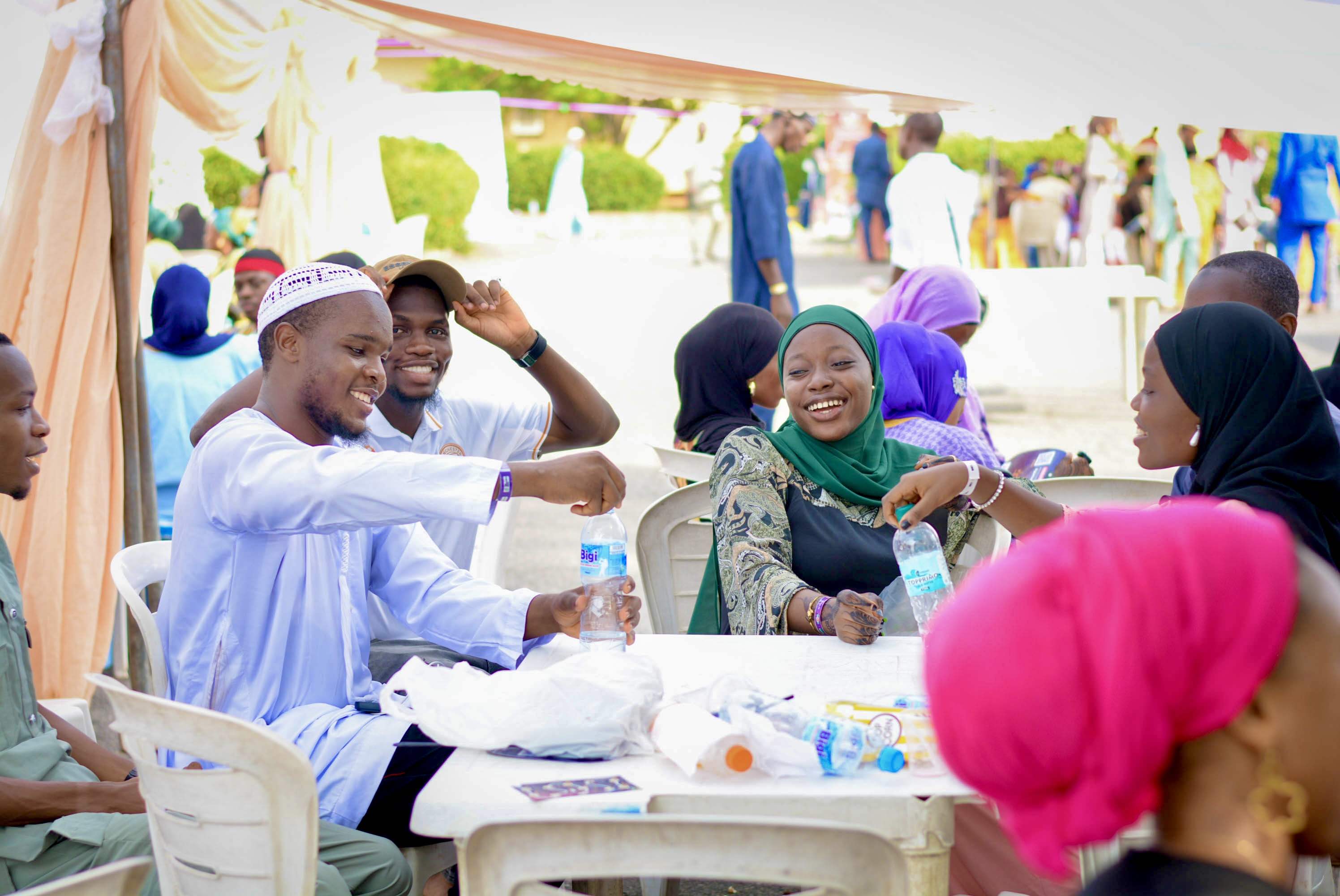 Attendees socializing and enjoying refreshments at EidGlitz