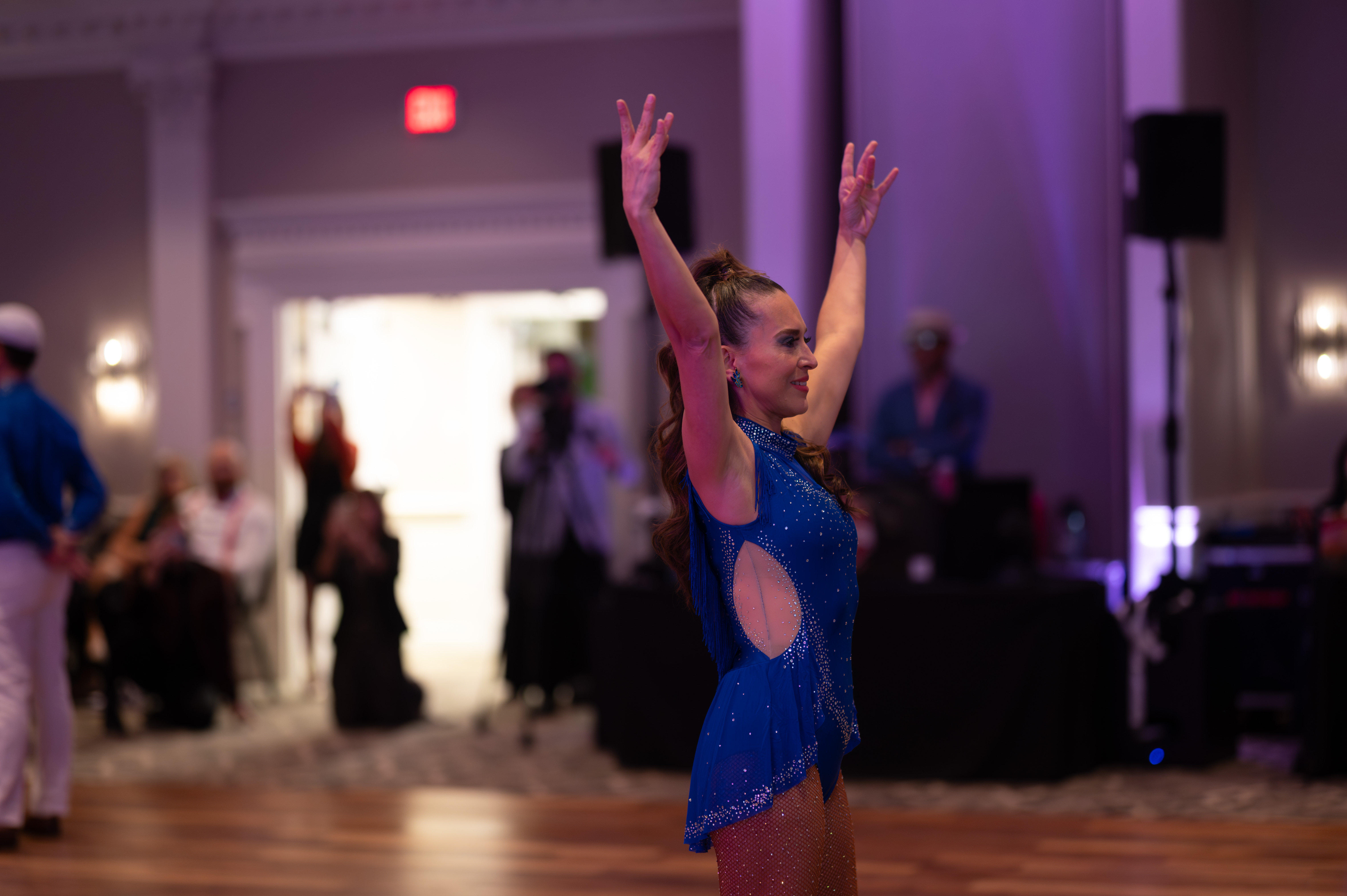 Female dancer with arms raised