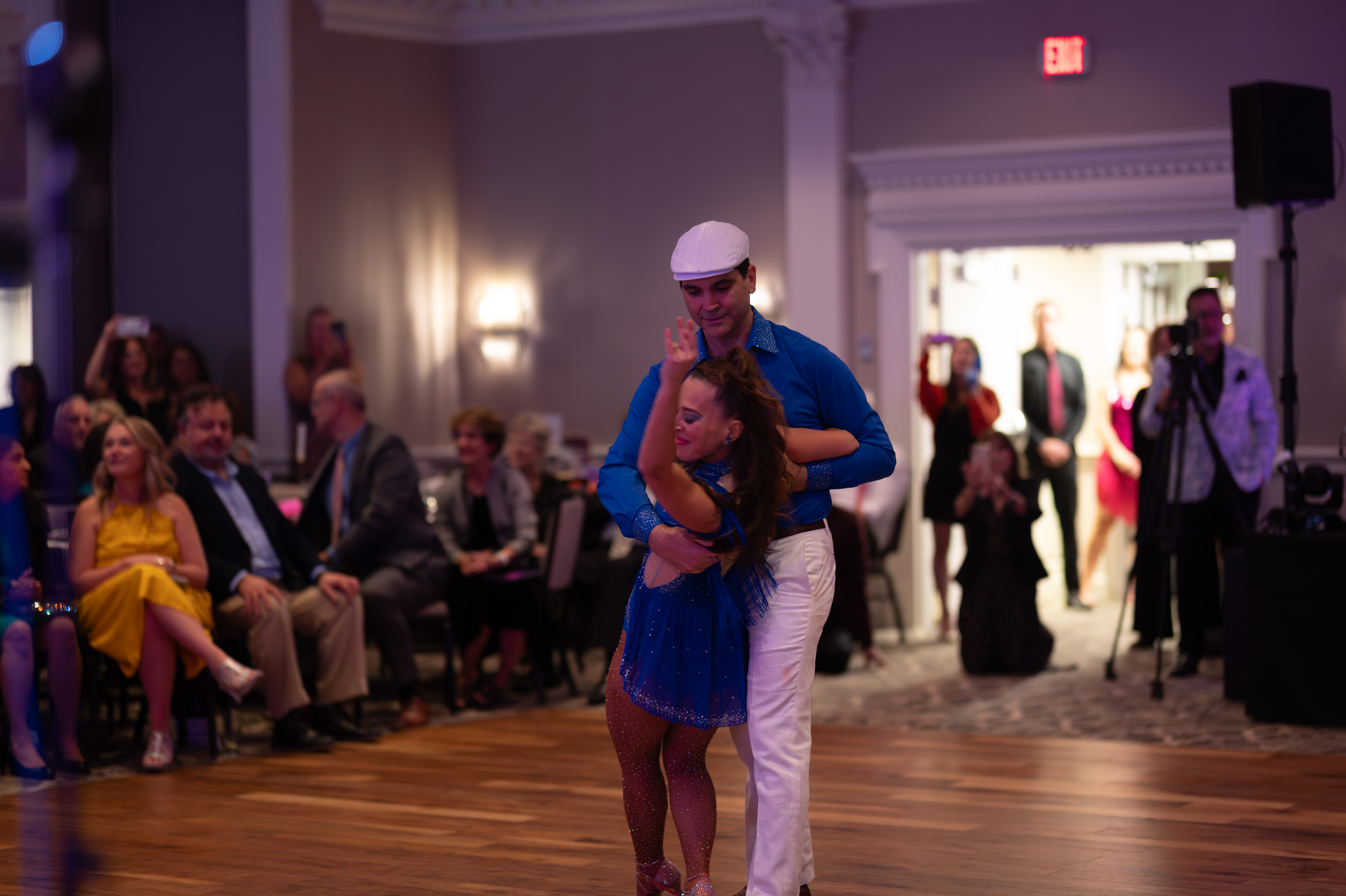 Dancers performing dip move at gala