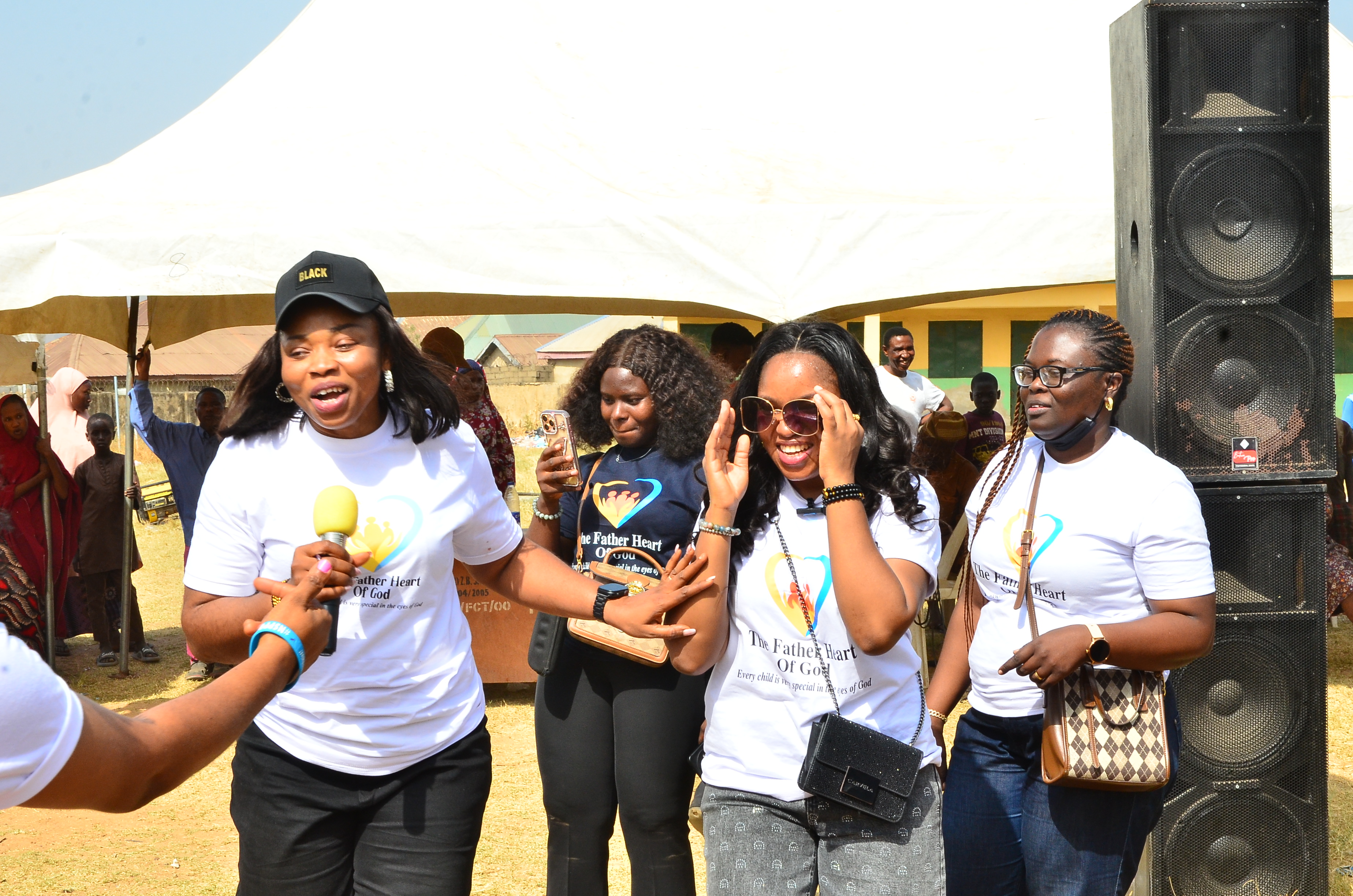 Foundation team members at event with microphone