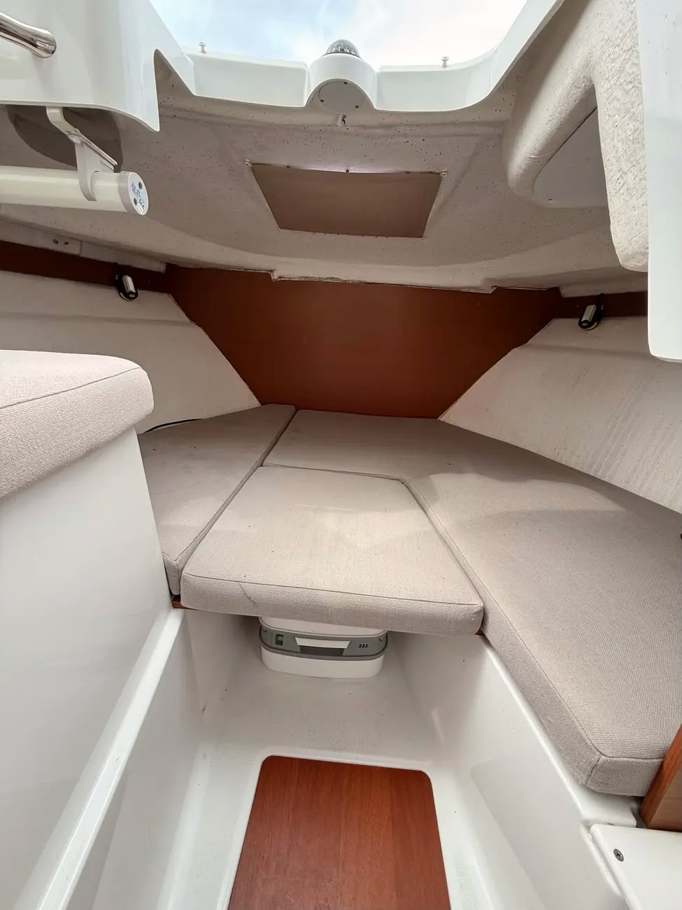 The forward berth converted into a double with wraparound cushions