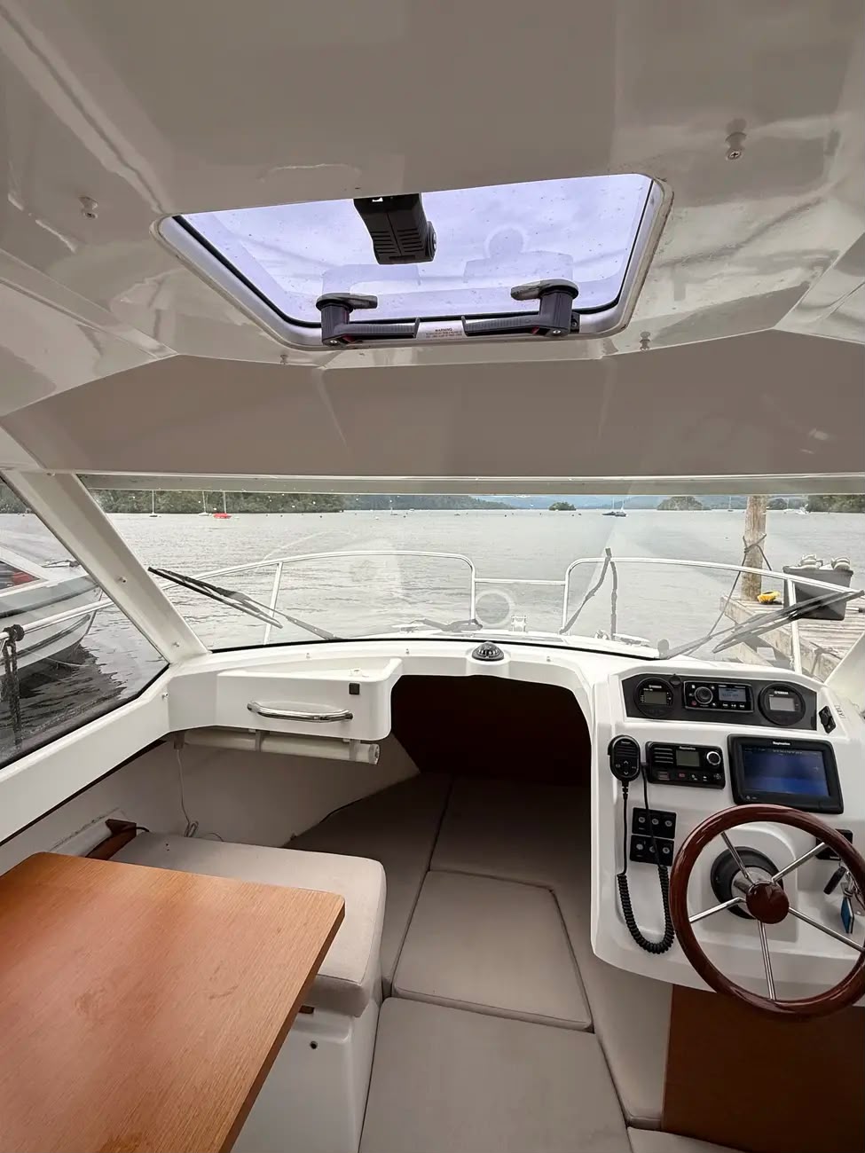 Interior with the overhead wheelhouse hatch open for light and air