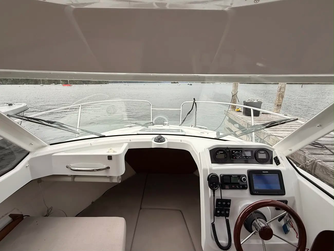 Cockpit and forward berth entrance with the helm dashboard to the side