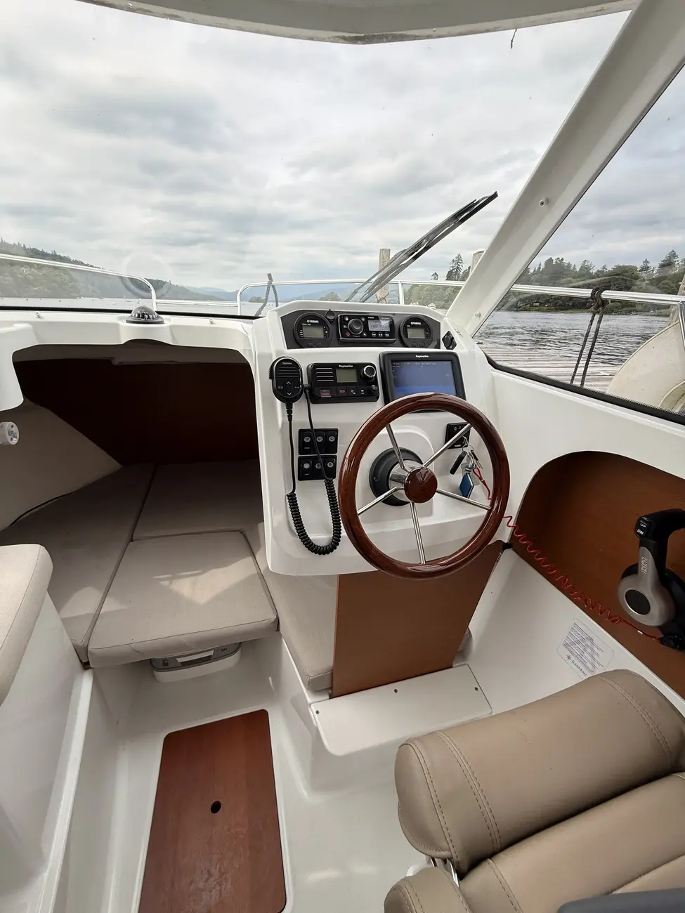 Helm station and skipper seat aboard the Merry Fisher 605