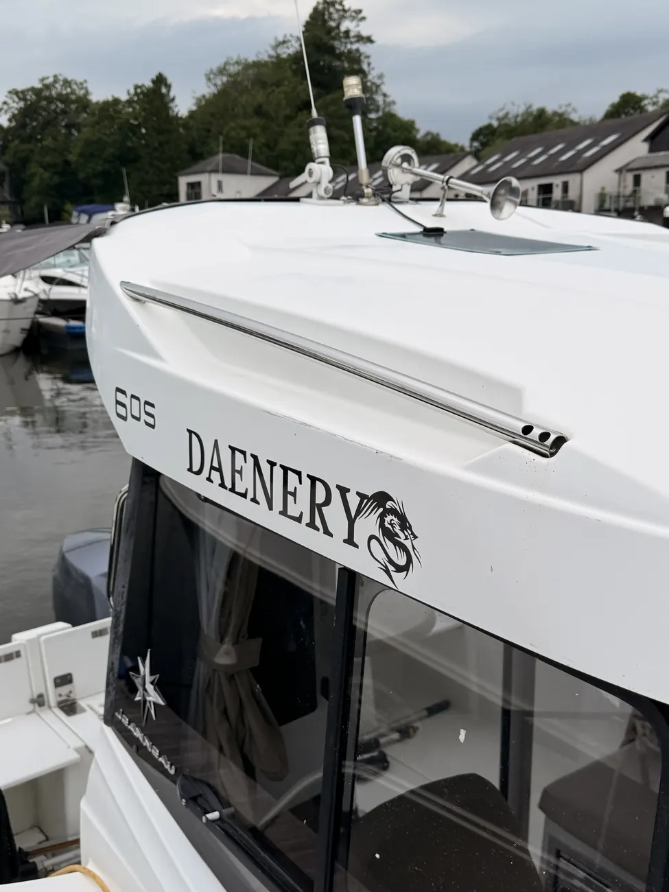 Close-up of the "Daenerys 605" name decal on the coachroof of the Merry Fisher 605