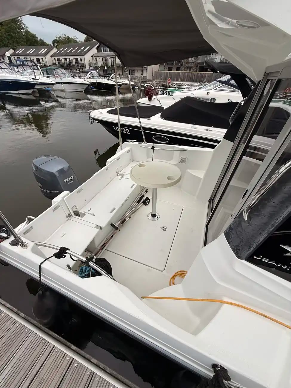 Aft cockpit seen from above with the cockpit table and Yamaha 100 outboard