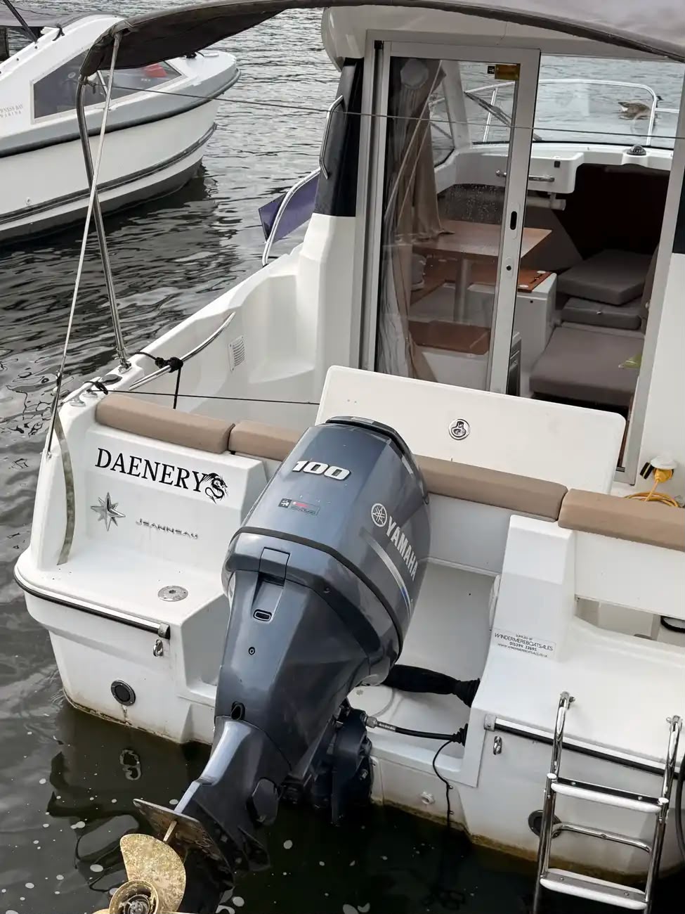 Stern of the Merry Fisher 605 with its grey Yamaha 100 four-stroke outboard
