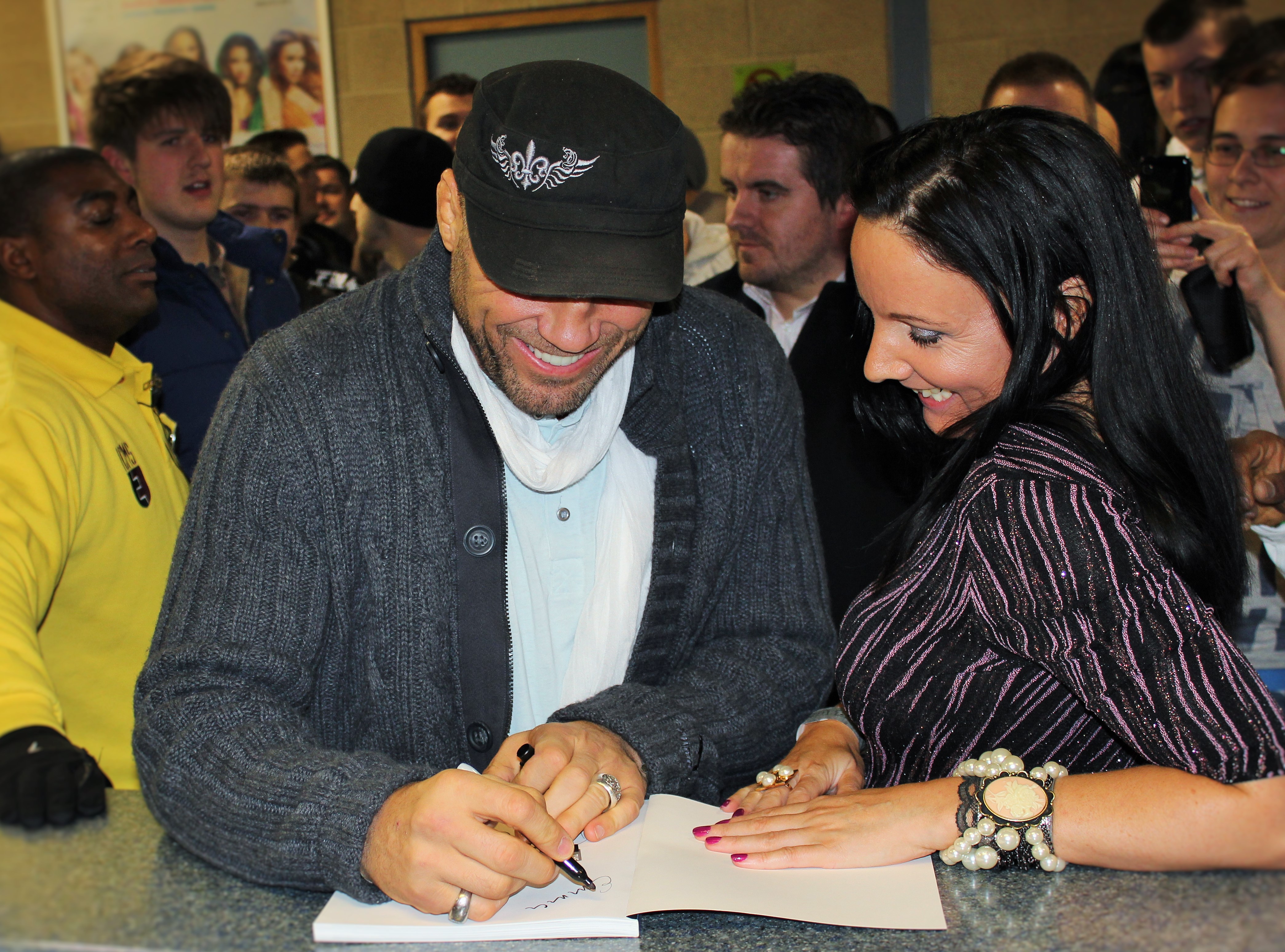 Randy Couture signing autographs for fans