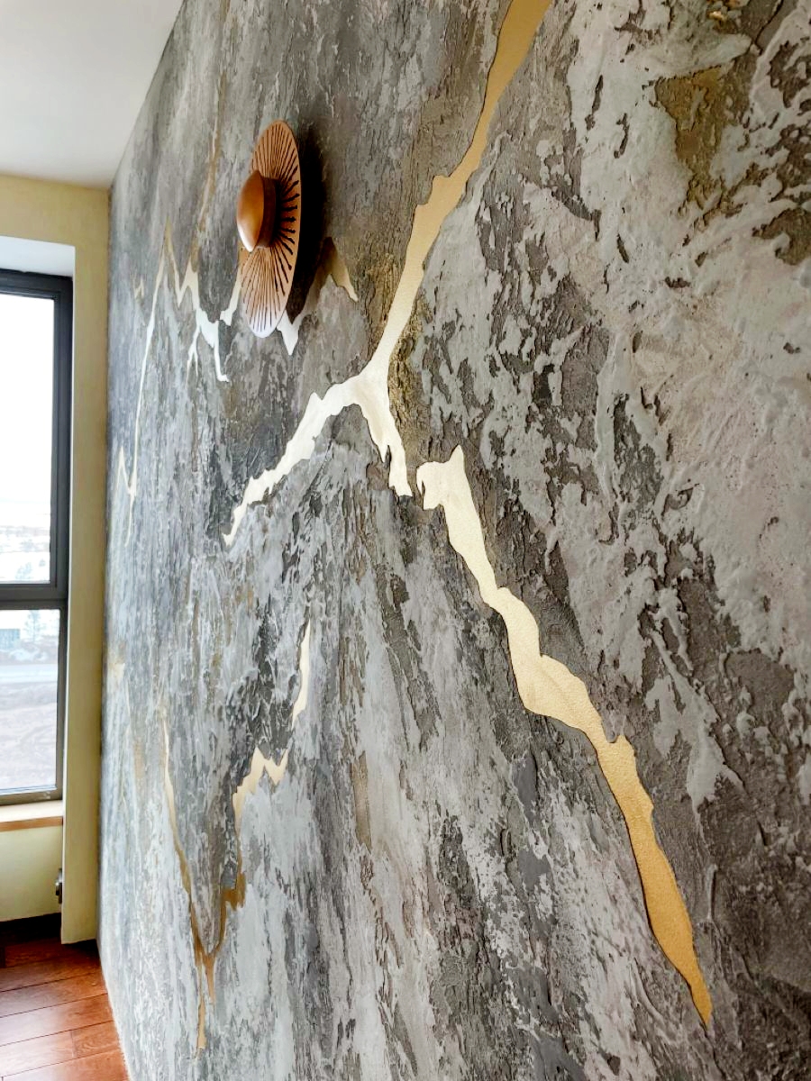 Construction detail of decorative finish application with gold accent stripe