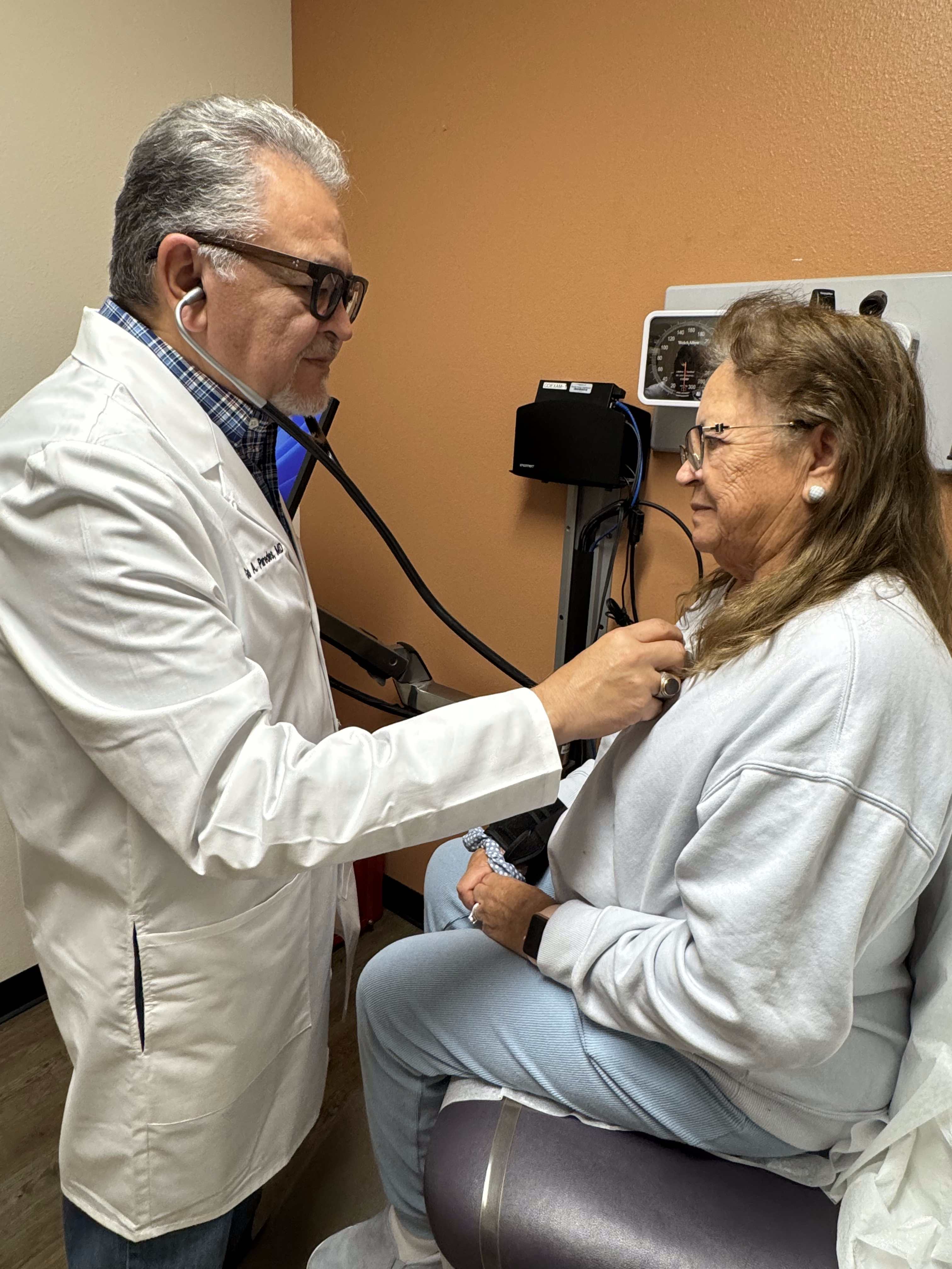 Dr. Paredes examining a patient