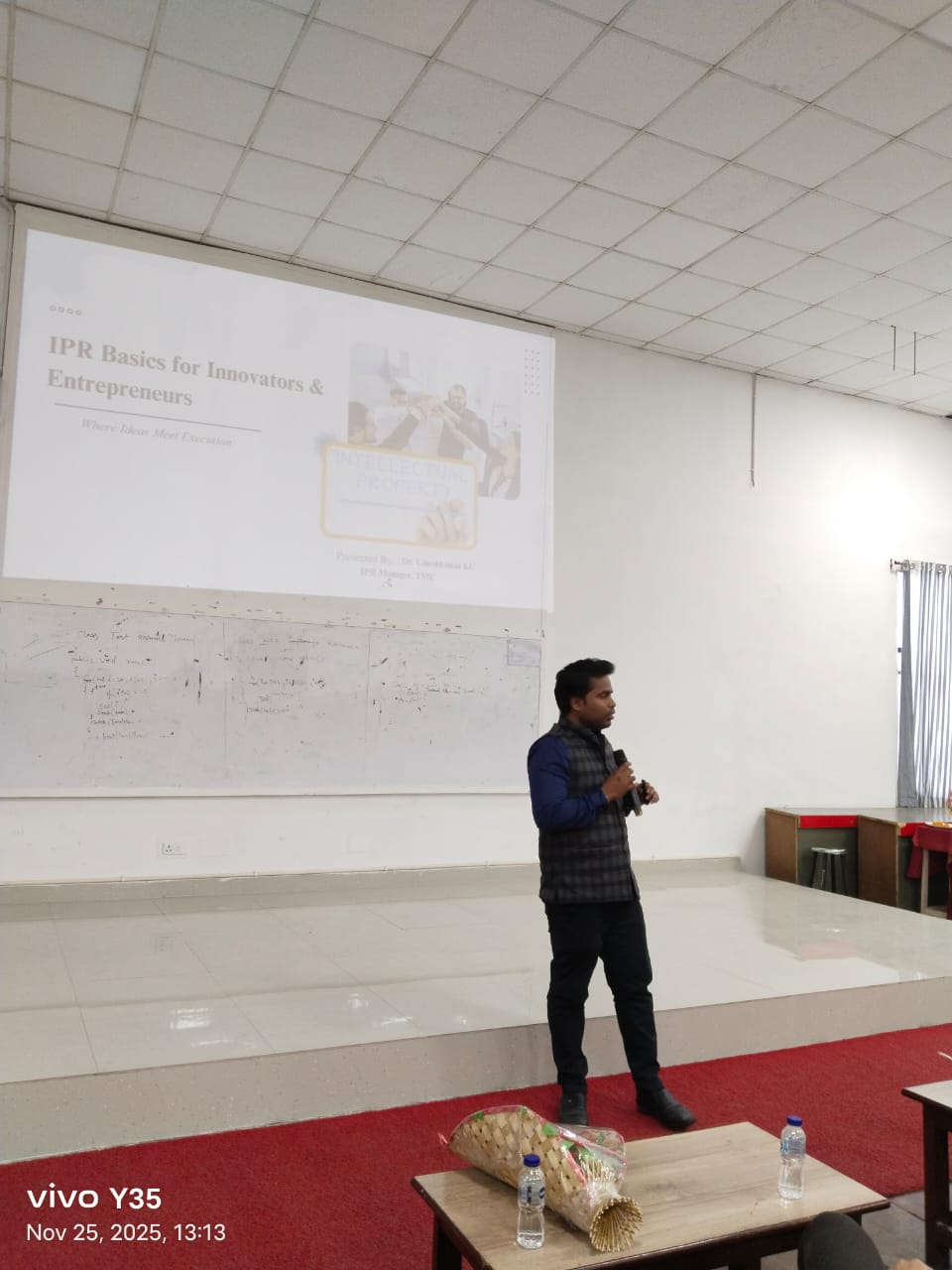 Dr. Umeshkumar KU presenting a slide titled IPR Basics for Innovators and Entrepreneurs at TMU