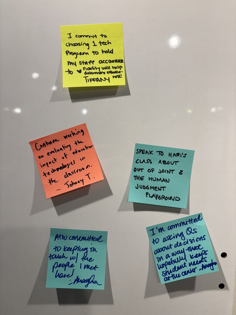 Individual commitment cards on whiteboard in yellow, red, and teal