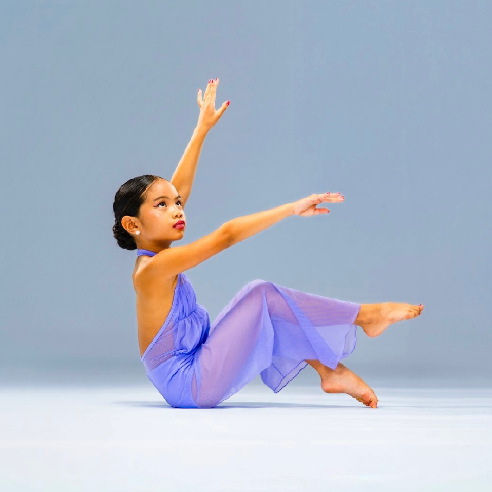 Pichara Luong performing contemporary dance in a lavender costume