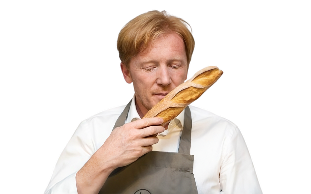 Eric Kayser founder with fresh baguette