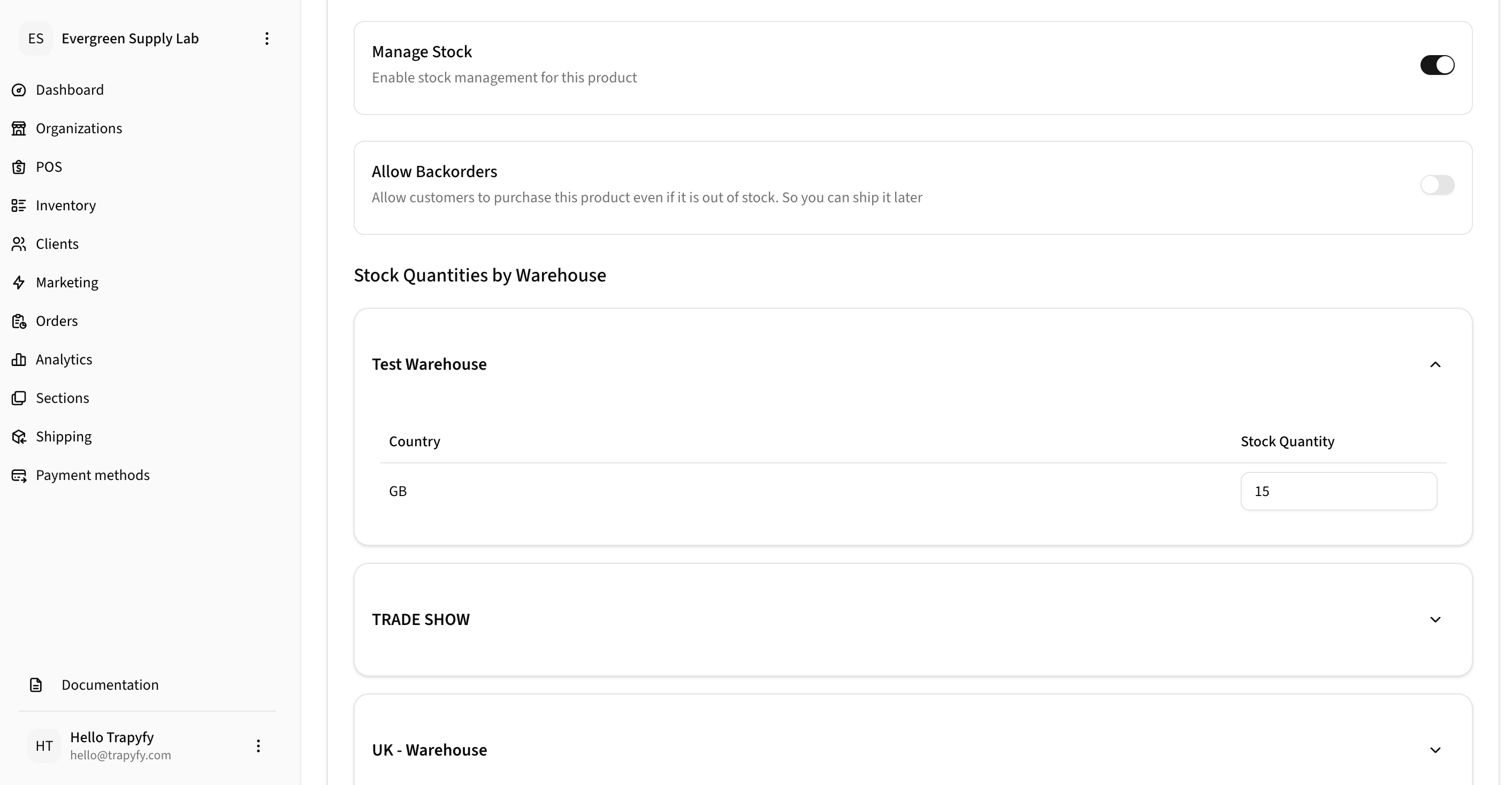 Inventory tab showing Manage Stock toggle, Allow Backorders toggle, and Stock Quantities by Warehouse section with Test Warehouse expanded showing GB country with stock quantity 15, and TRADE SHOW and UK Warehouse collapsed