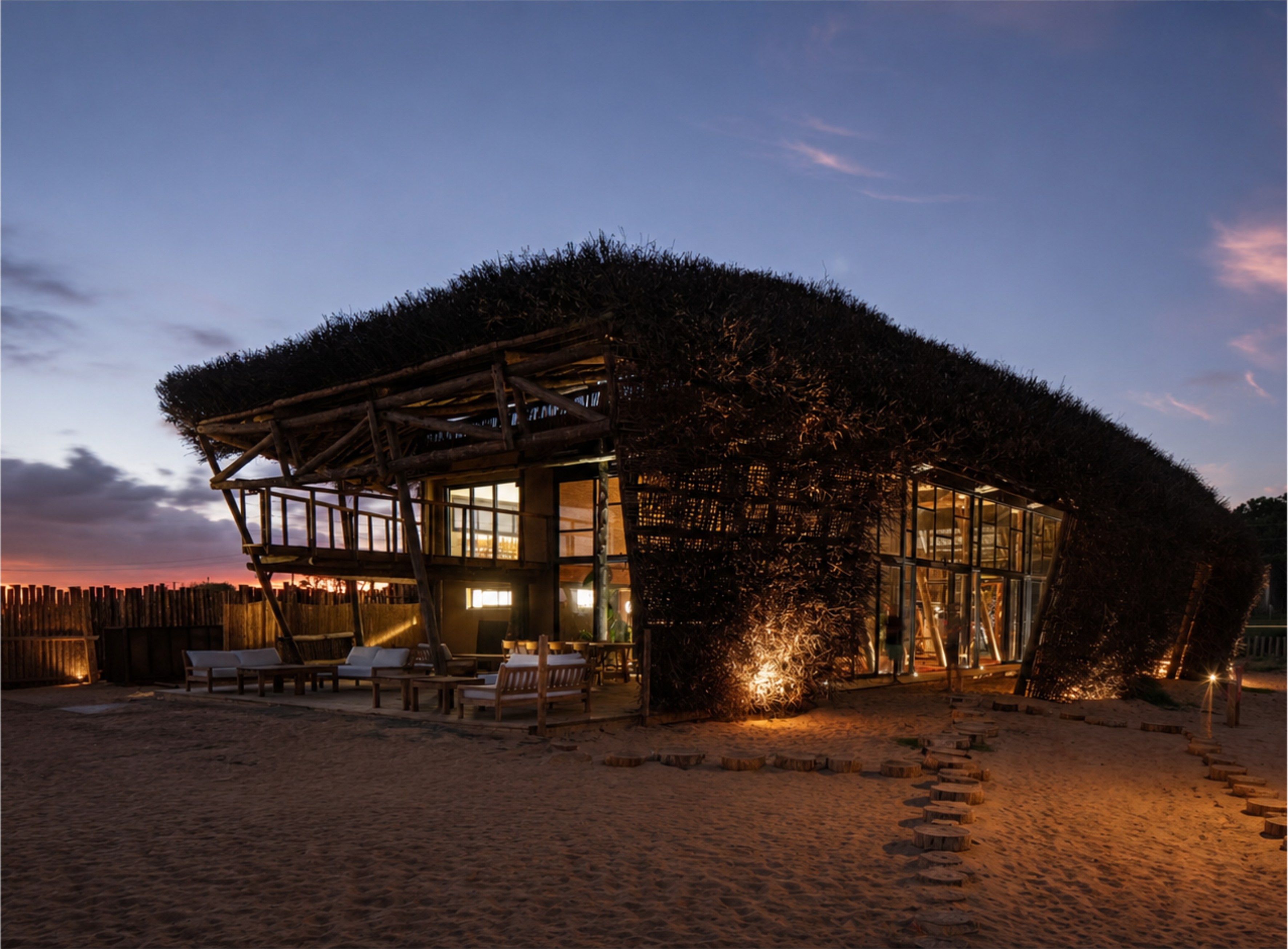 El Nido Beach & Surf Homes al atardecer con su arquitectura de techo de junco