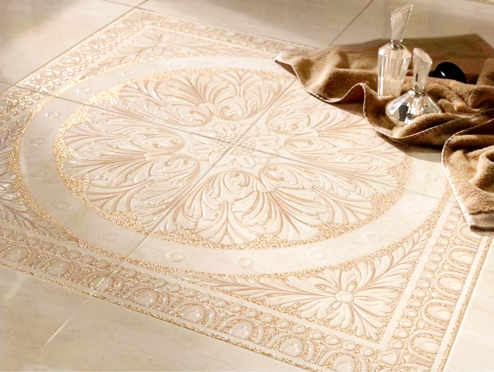 Ornate plaster decorative basin with intricate carved relief patterns in cream and gold