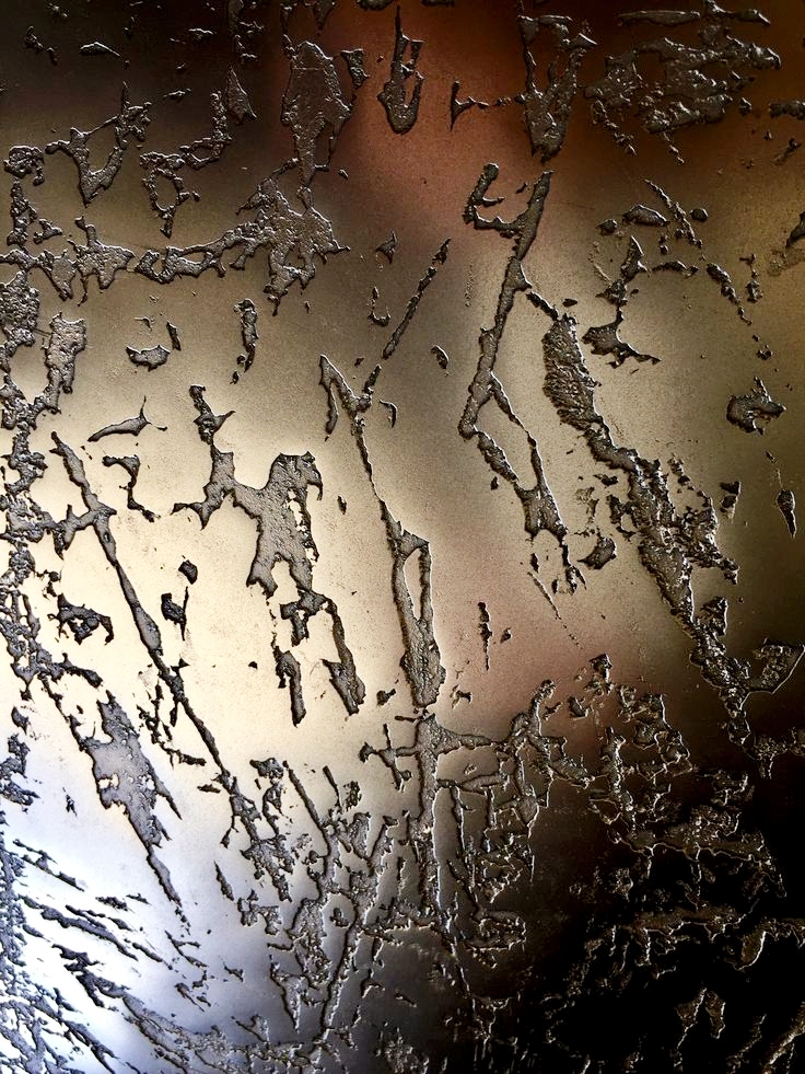 Ornate ceiling plaster detail with hand-applied decorative motifs and gold leaf accents