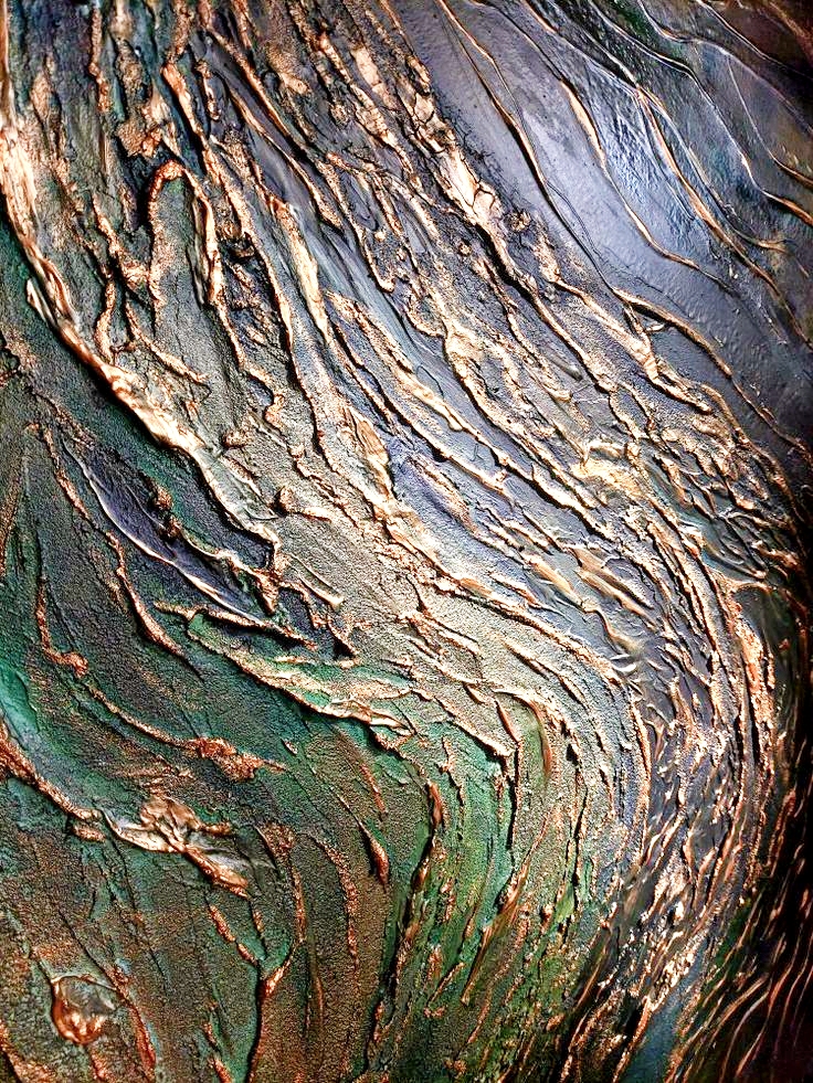 Heavily textured metallic finish with oxidized green and gold patina surface