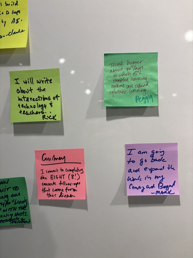 Multiple colorful commitment cards on whiteboard from participants