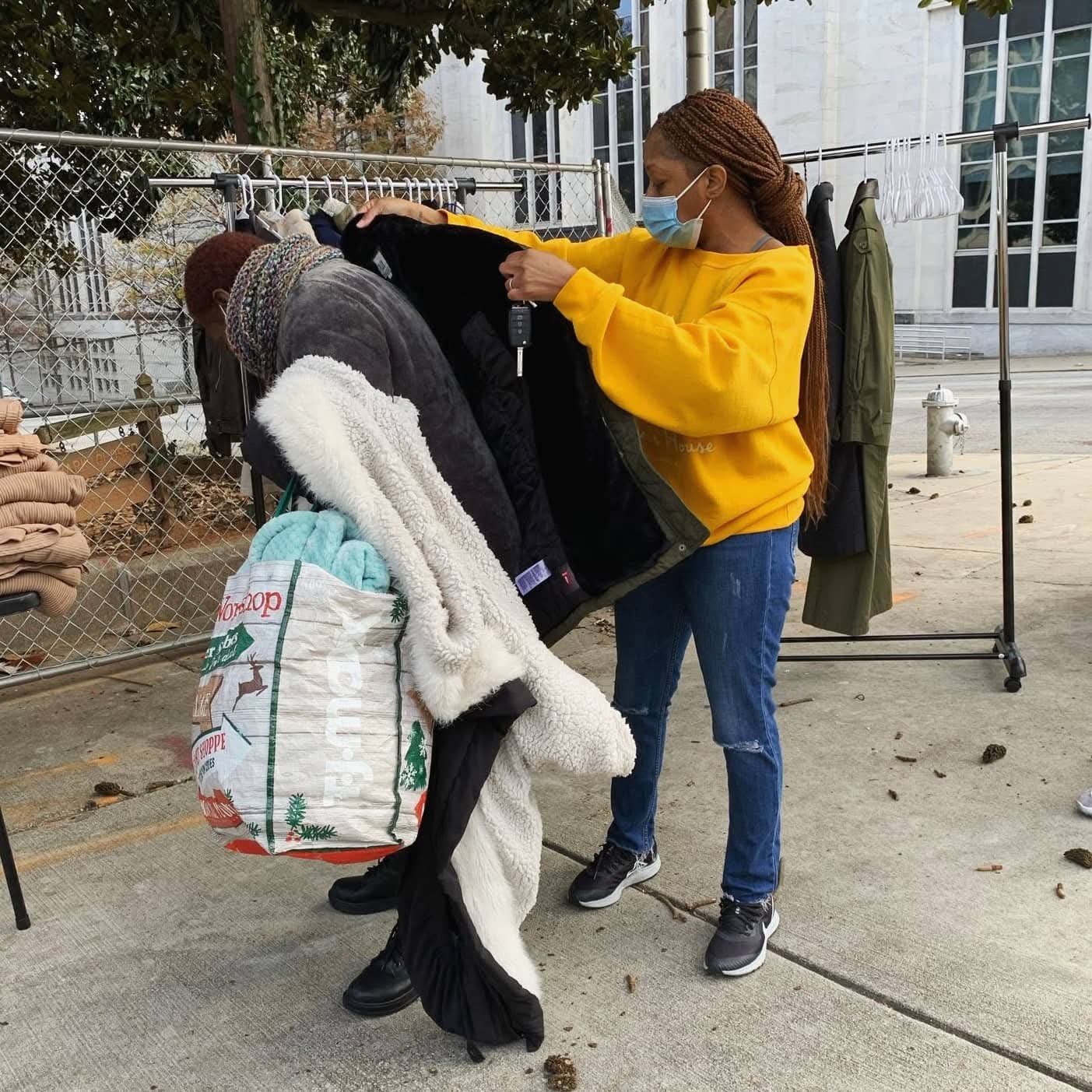 Volunteer sorting donated clothing