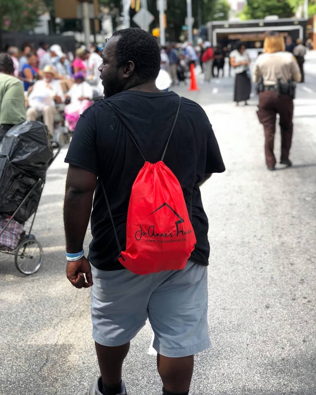 Community member with backpack at event