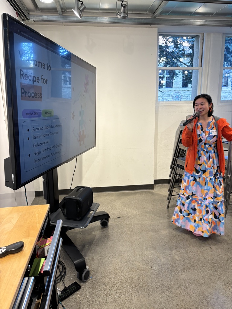 Sunanna presenting at microphone with "Recipe for Process" slide visible