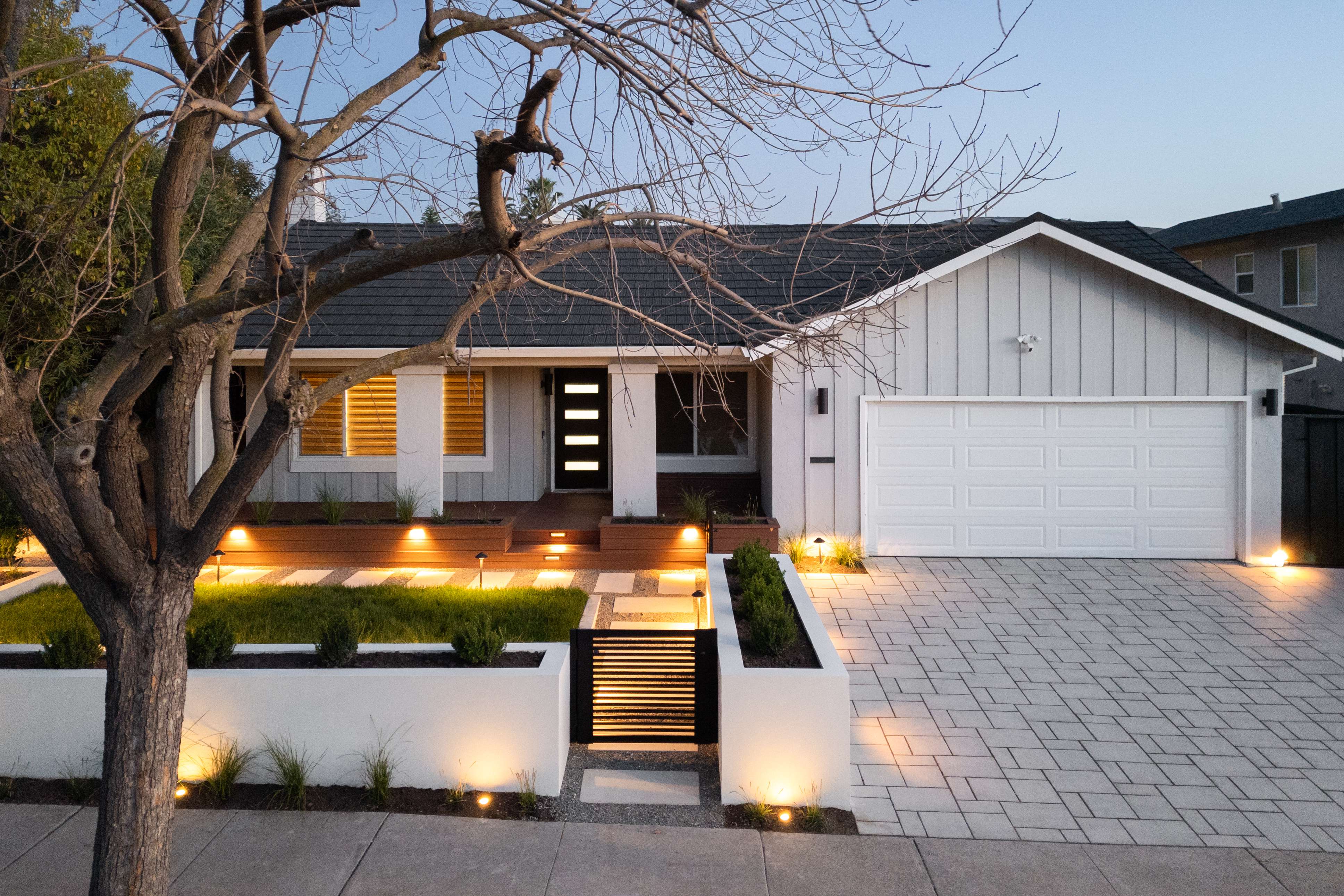 Fremont residence front yard at twilight with landscape lighting