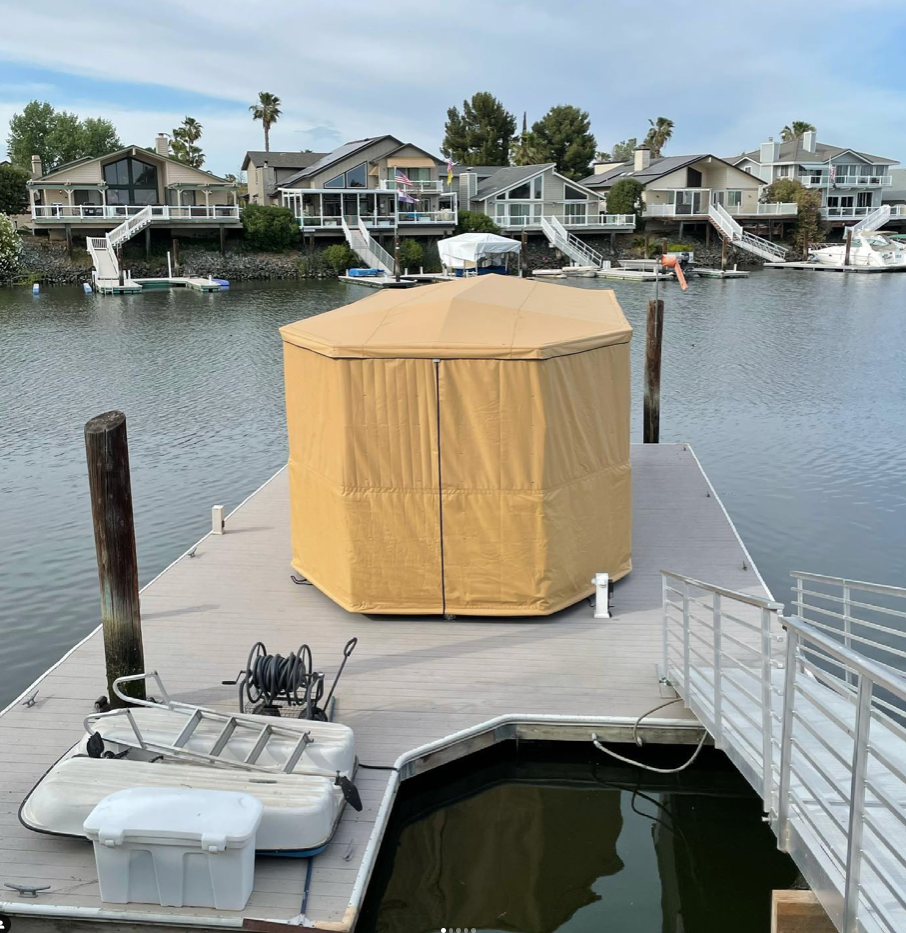 Gold octagonal freestanding Touchless Cover on a residential floating dock