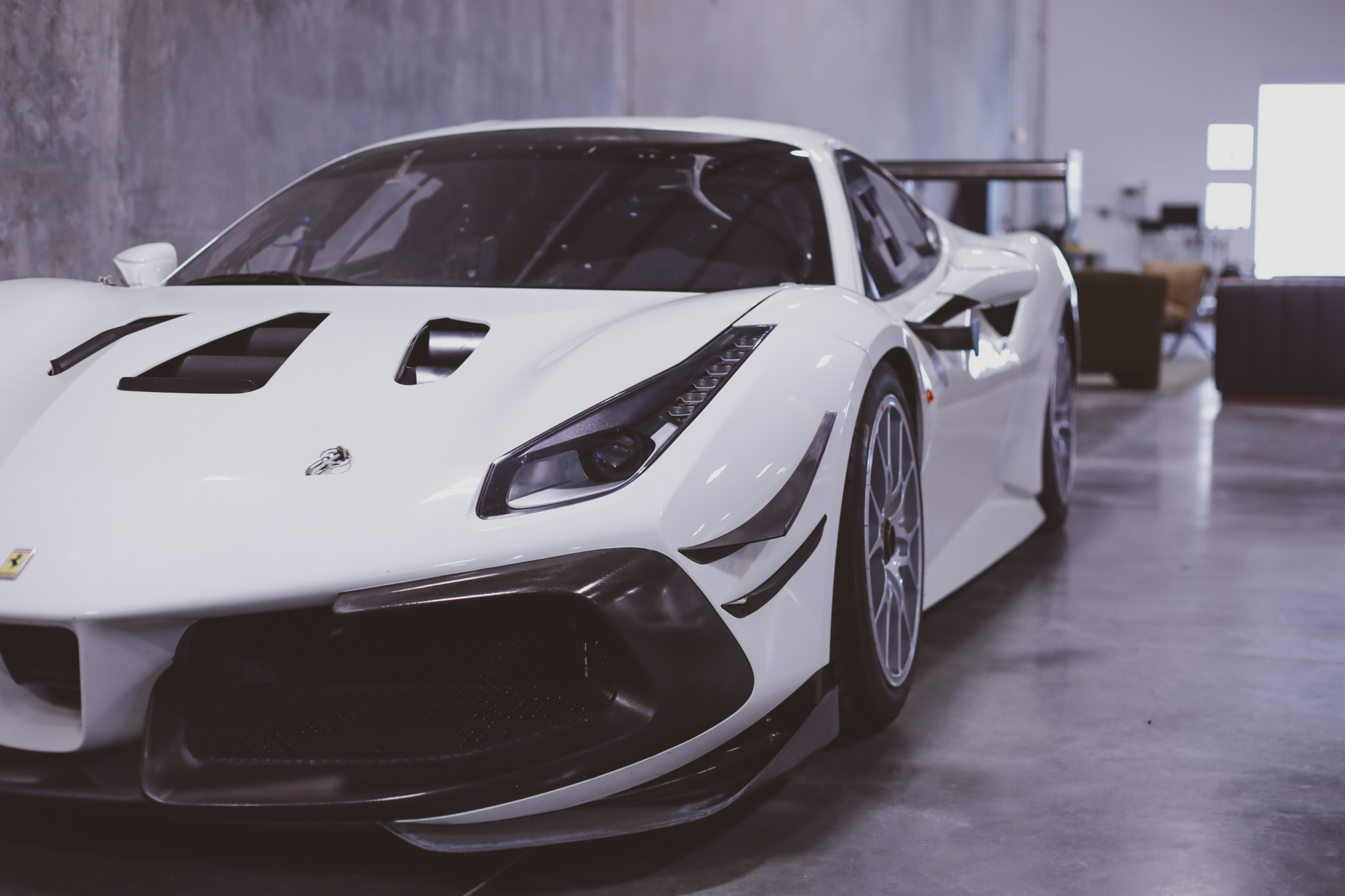 Ferrari 488 Challenge race car in white with full aero kit, carbon splitter and wing