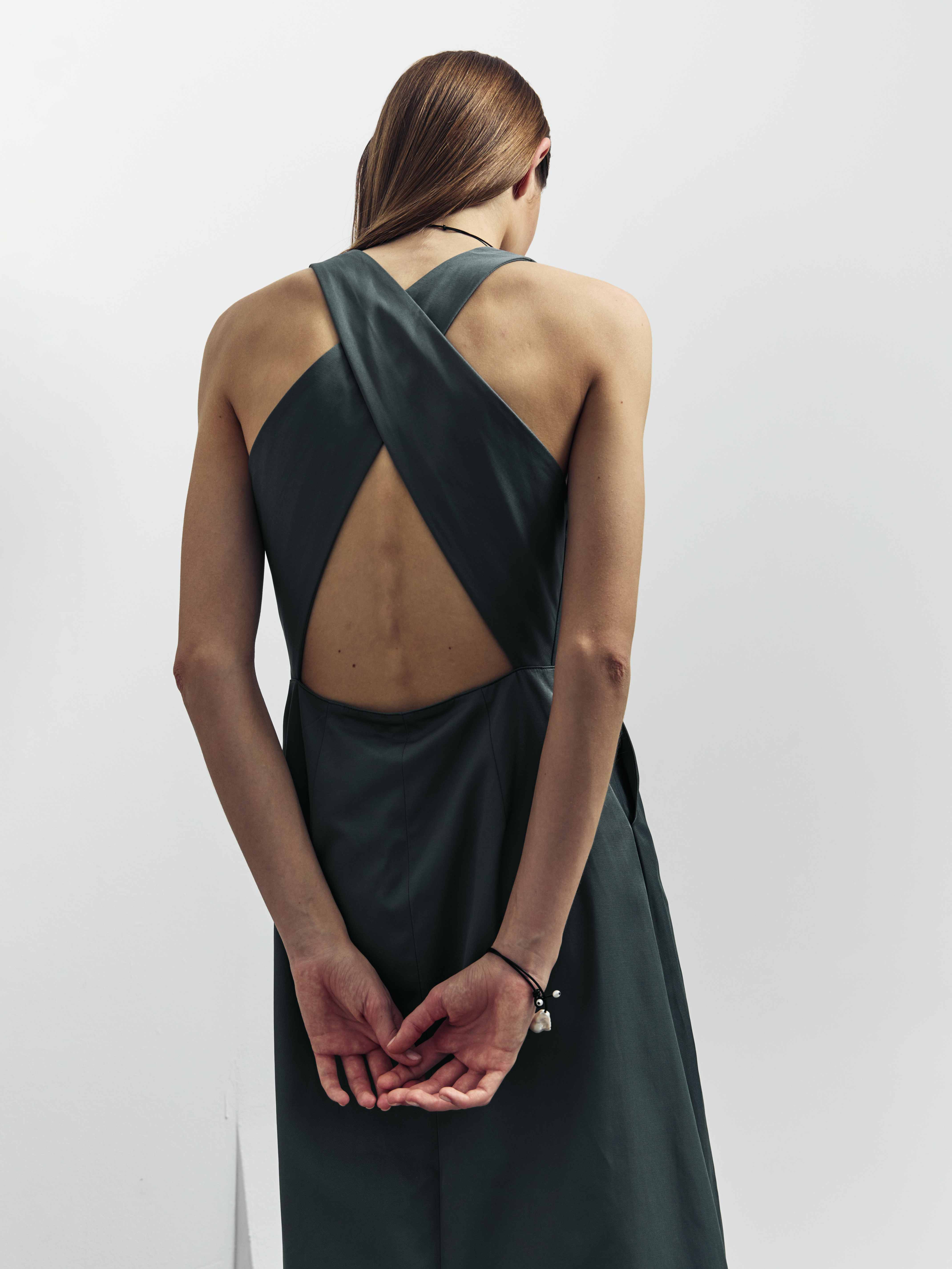 Catalogue before retouching — teal backless cross-strap dress, back view