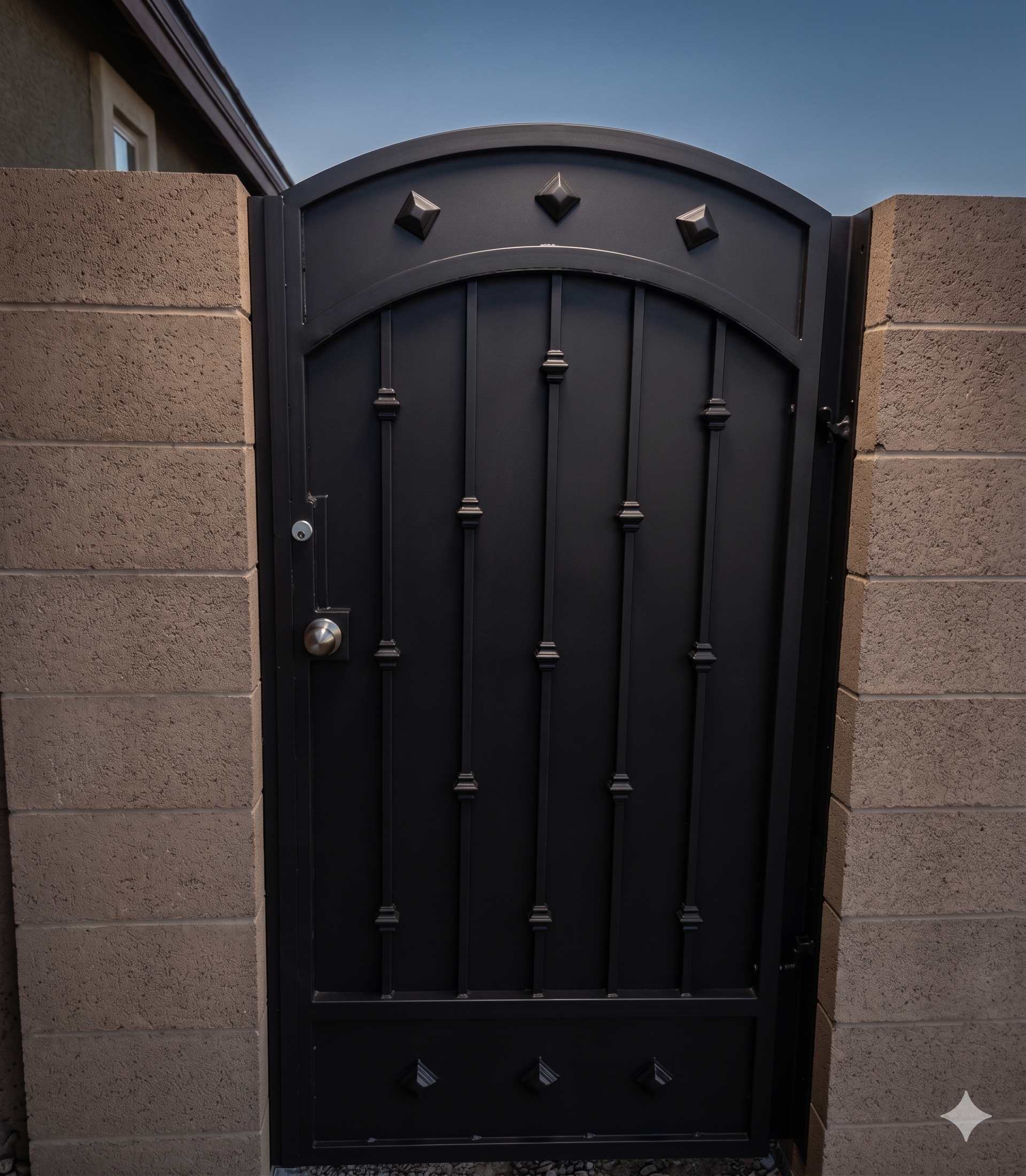 Arched side gate with vertical bars and diamond accents in matte black