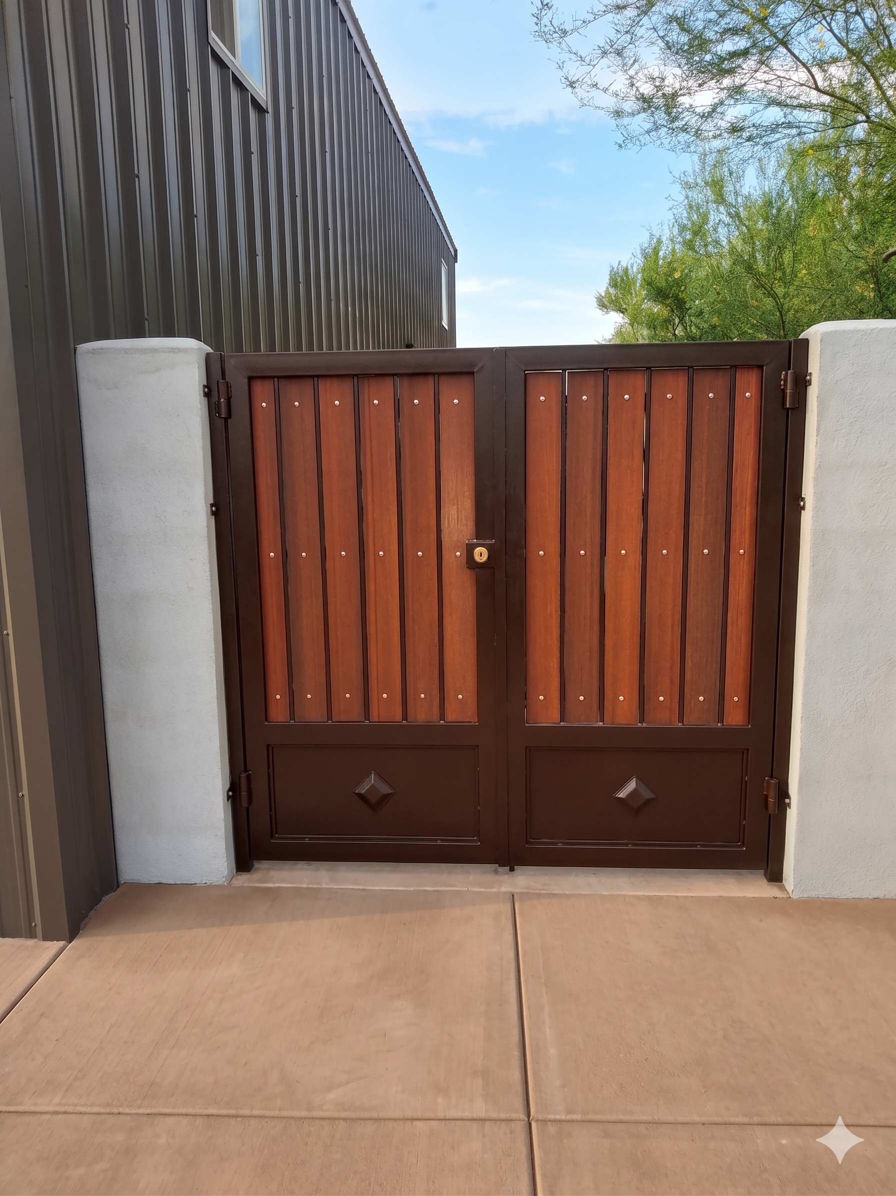 Double RV gate with mahogany wood panels and diamond accents