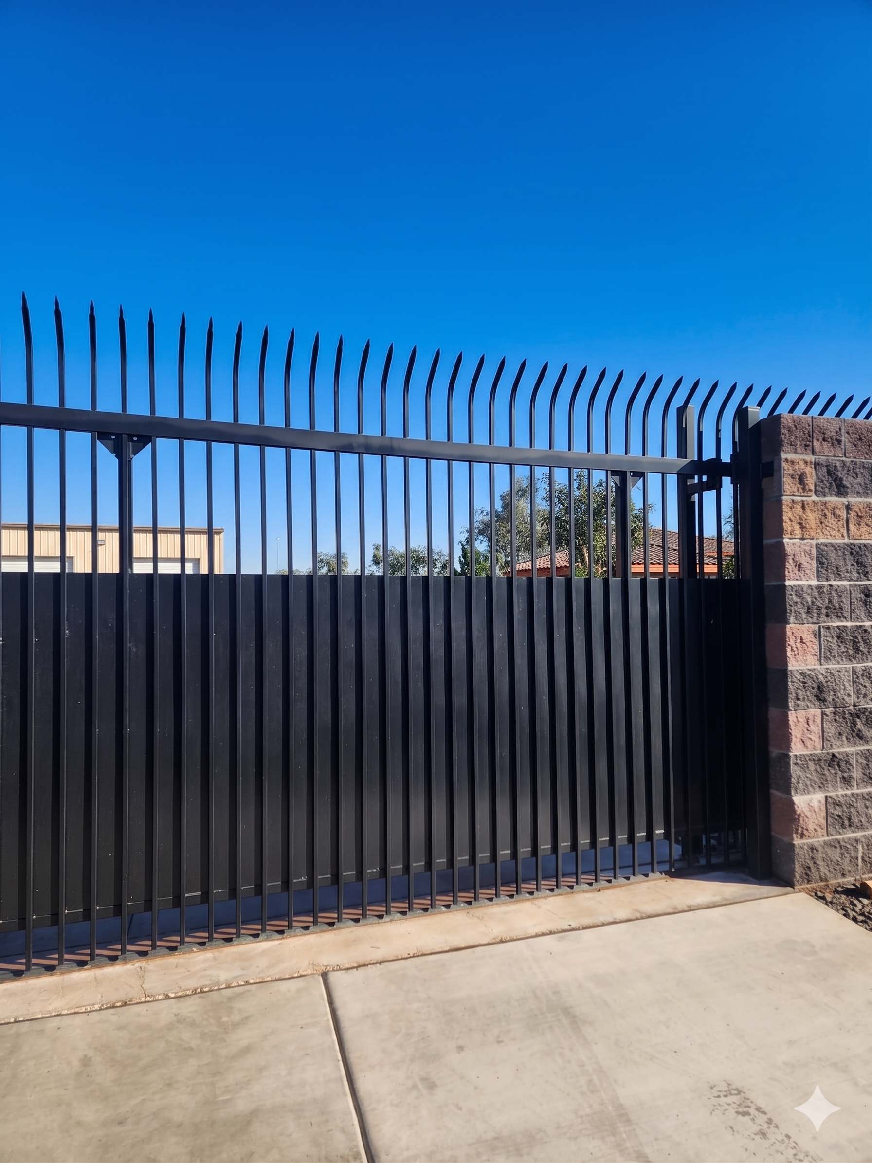 Black security fence with spear top finials