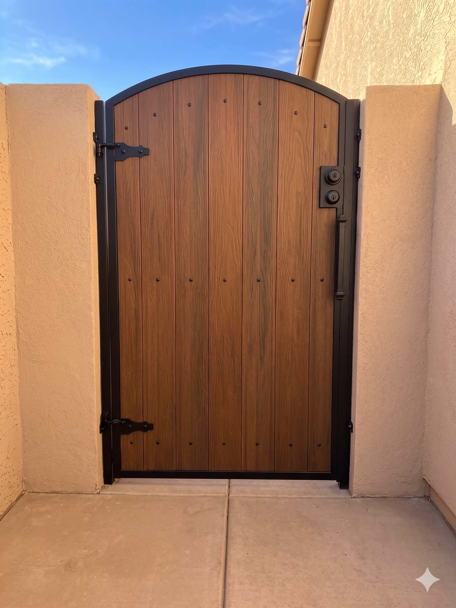Elegant arched side gate with rich wood grain finish and bronze hardware