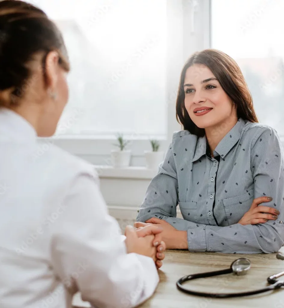 Mature woman smiling at sunset during menopause