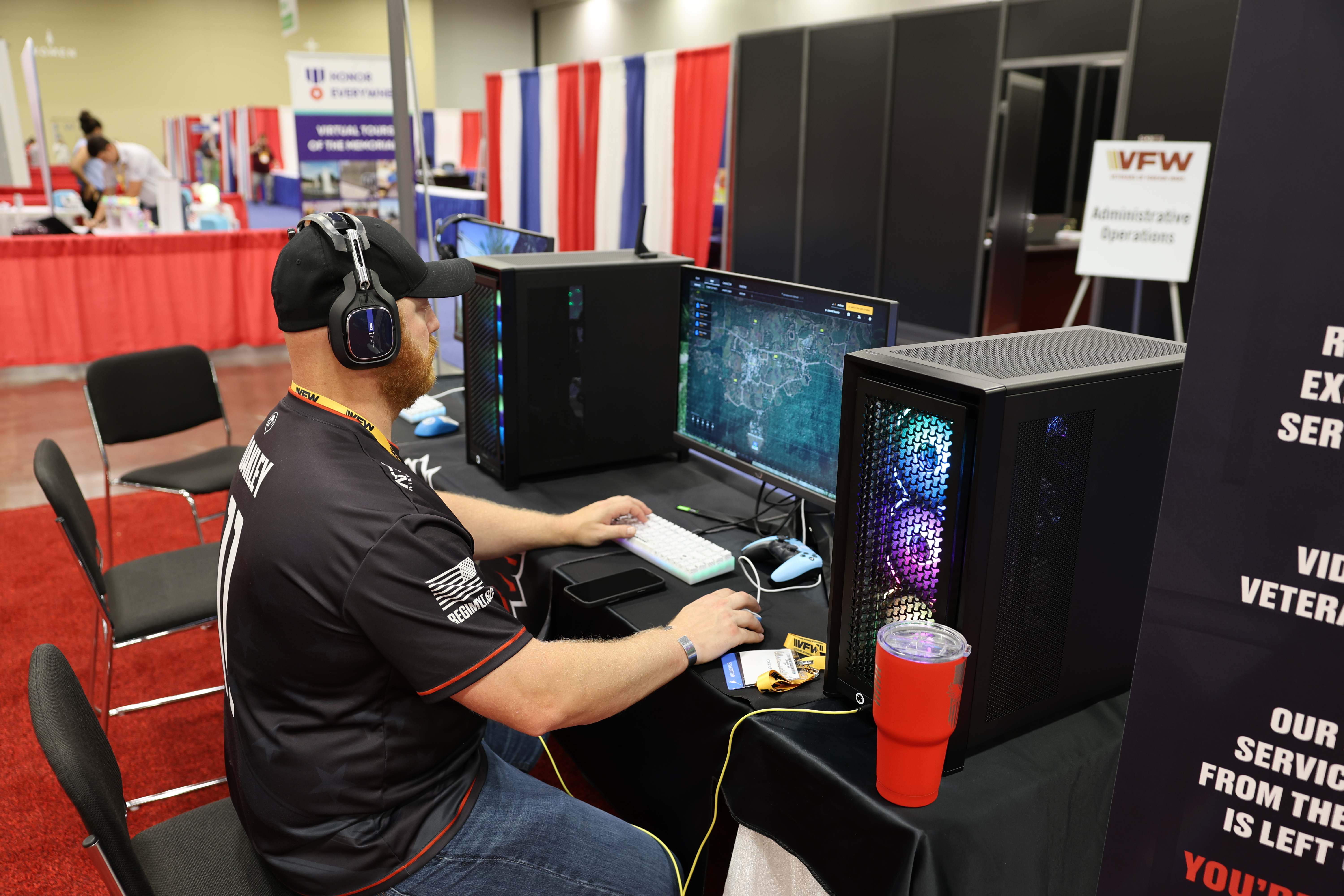 Veteran gaming at VFW convention Combat Tested Gaming booth with RGB PC setup