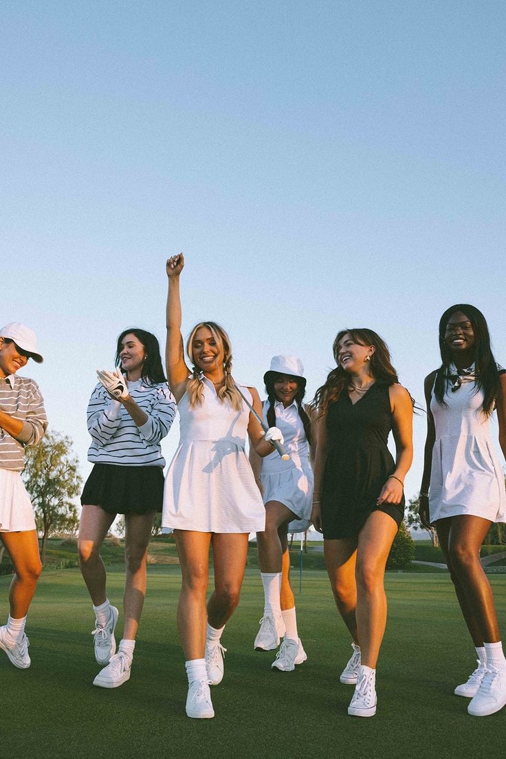 Group of women golfers celebrating on a golf course